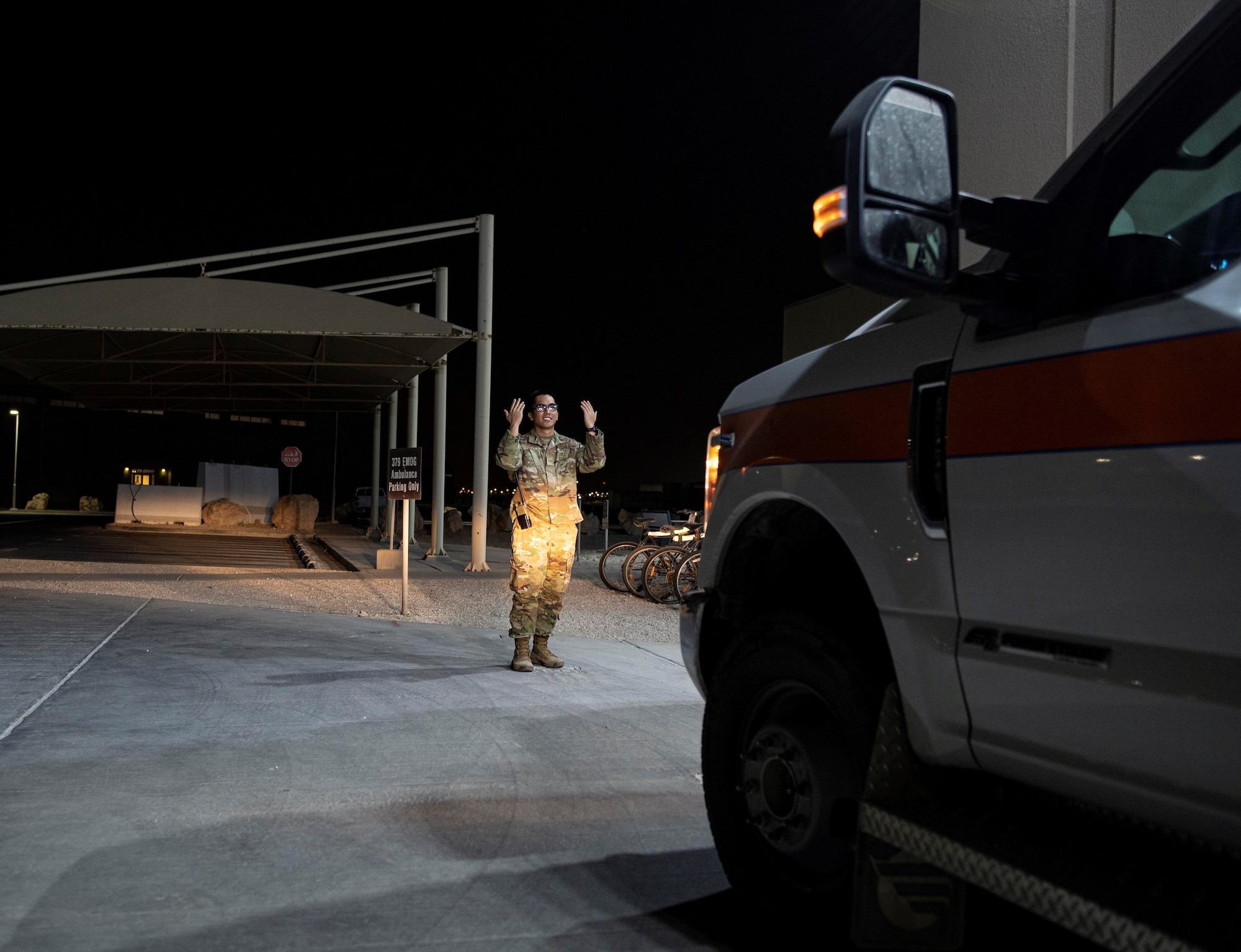 U.S. Air Force Senior Airman Raphael Silva, 379th Expeditionary Medical Group, guides an ambulance during a vehicle inspection July 25, 2022 at Al Udeid Air Base, Qatar. 379th EMG medics are on call 24 hours a day to respond to emergencies. (U.S. Air National Guard photo by Master Sgt. Michael J. Kelly)