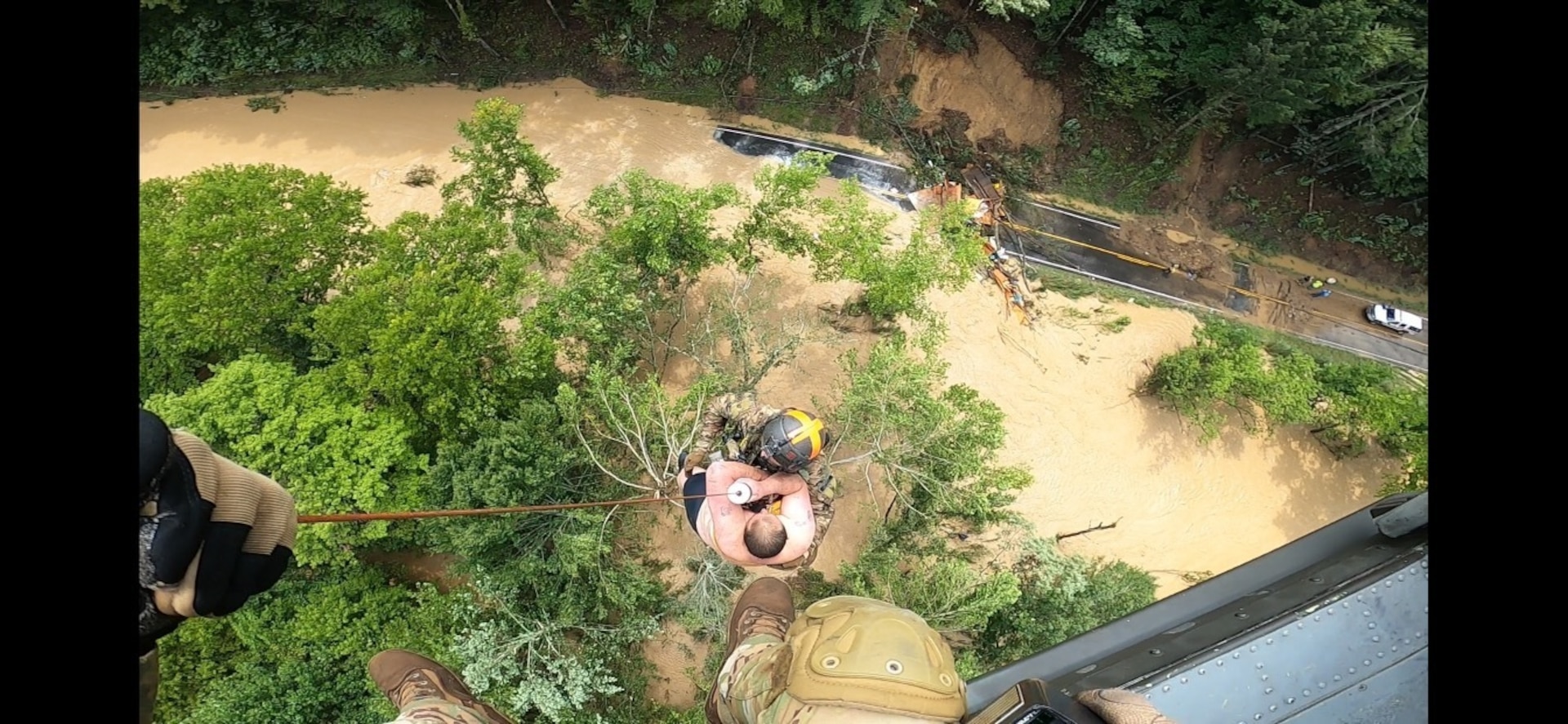 Kentucky Army National Guard's Detachment 1, Charlie Company 2/238th Aviation Regiment, MEDEVAC, conducts hoist and land rescue mission for victims of flooding in eastern Kentucky July 28, 2022. Pilots and crew have been working constantly for days to rescue victims trapped on house roofs, in trees and other high points to avoid floodwaters.