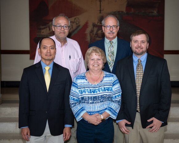 Carderock's Full Ship Shock Trial (FSST) Team take a moment to pose on May 23, 2022, in celebration of receiving the Dr. Delores M. Etter Top Scientists and Engineers Team Award for their work in executing the FSST on USS Gerald R. Ford.