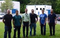 Team members of the Constellation-class Deamping System Design Team stand together for a picture.