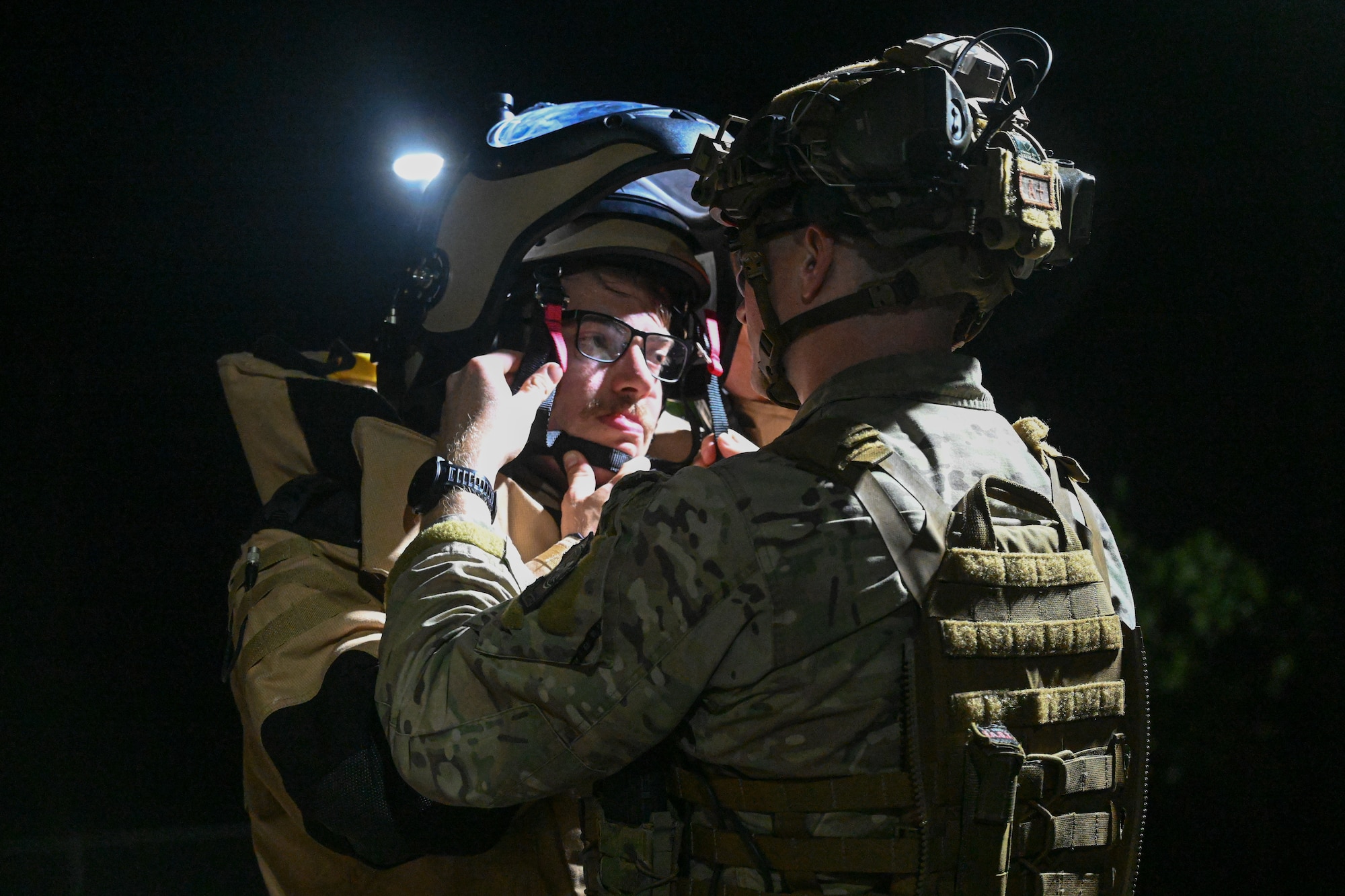 An Airman puts on an EOD suit.