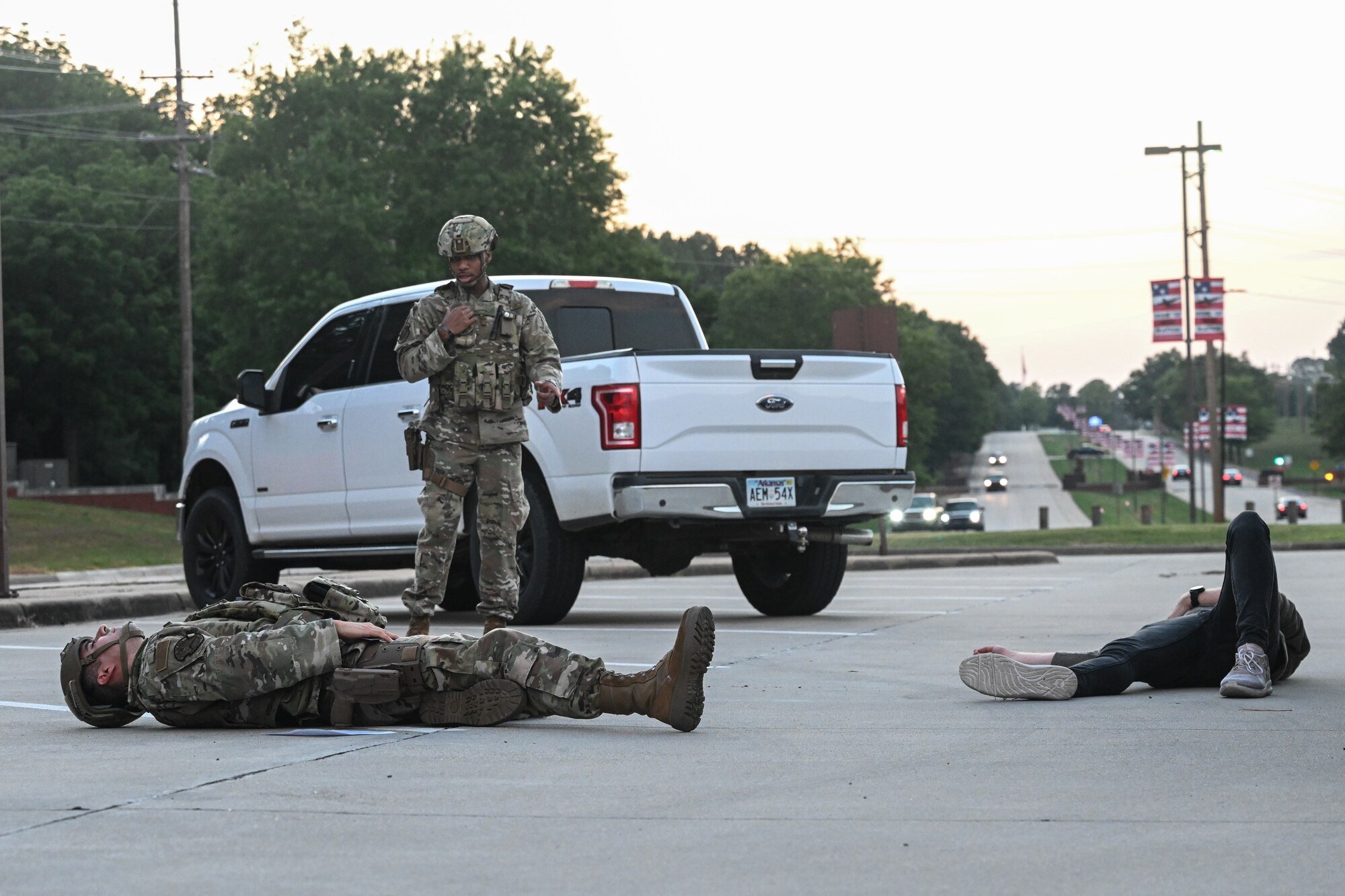Airmen lay on the ground.
