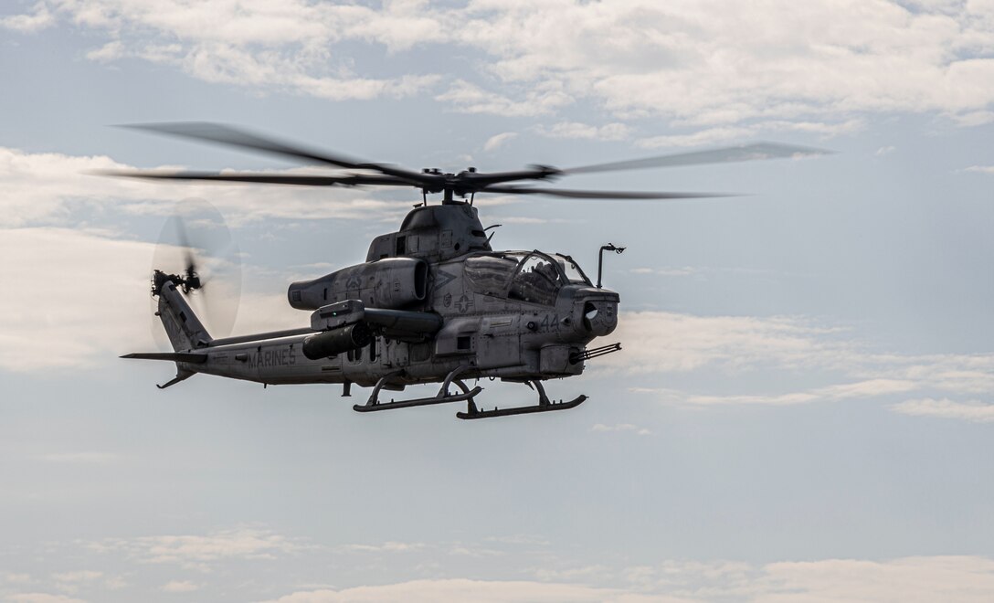 An AH-1Z Viper with Marine Light Attack Helicopter Squadron 369, Marine Aircraft Group 39, 3rd Marine Aircraft Wing, flies towards a range during exercise Summer Fury 22 in Bradley, California, August 1, 2022. Summer Fury 22 enhances Marine-Air-Ground Task Force integration and increases aviation operations proficiency with realistic, relevant training to ensure the Marine Corps’ largest aircraft wing remains operationally excellent, interoperable, deployable on short notice and lethal when called into action. (U.S. Marine Corps Photo by Cpl. Woodward)