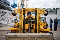 U.S. Marine Corps Lance Cpl. Duane Takala, a network administrator assigned to the 22nd Marine Expeditionary Unit, uses a forklift to maneuver a supply crate designated for the Wasp-class amphibious assault ship USS Kearsarge (LHD 3), during mid-deployment voyage repairs in Brest, France, June 30, 2022.