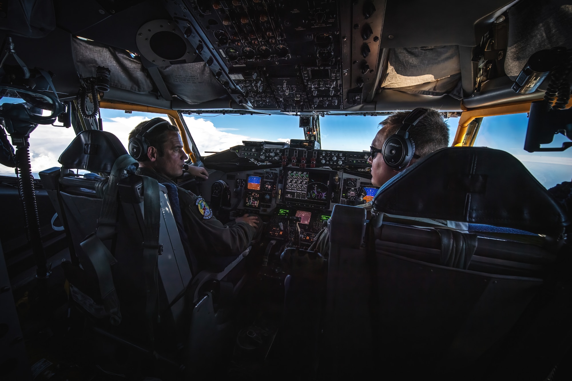 U.S. Air Force Maj. Robert Sherlock, 91st Air Refueling Squadron pilot, left, and Capt. Zachary Yacone, a 50th ARS pilot, fly a KC-135 Stratotanker aircraft assigned to the 6th Air Refueling Wing over Florida, Aug. 2, 2022.