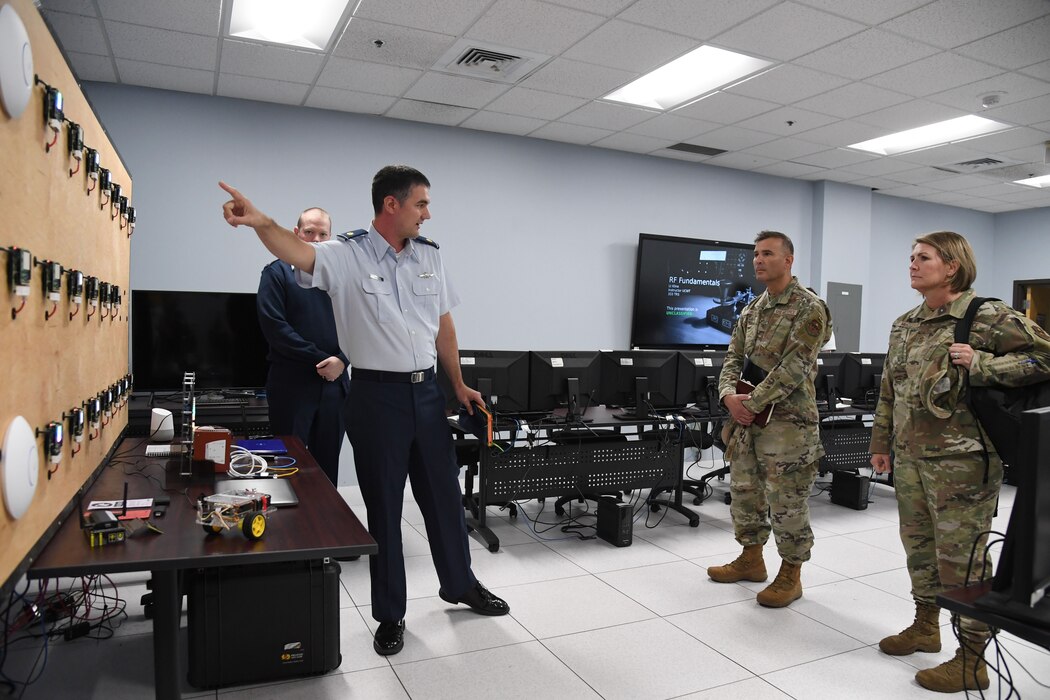 U.S. Air Force Maj. Lee Zaniewski, 333rd Training Squadron director of operations, briefs Col. Nicholas Dipoma, Second Air Force vice commander, and Chief Master Sgt. Kathleen McCool, Second Air Force command chief, on the tunneling lab training capabilities during an immersion tour of the 81st Training Group inside Stennis Hall at Keesler Air Force Base, Mississippi, July 29, 2022. The tour also included the Levitow Training Support Facility and the 81st Medical Group clinical research lab. (U.S. Air Force photo by Kemberly Groue)