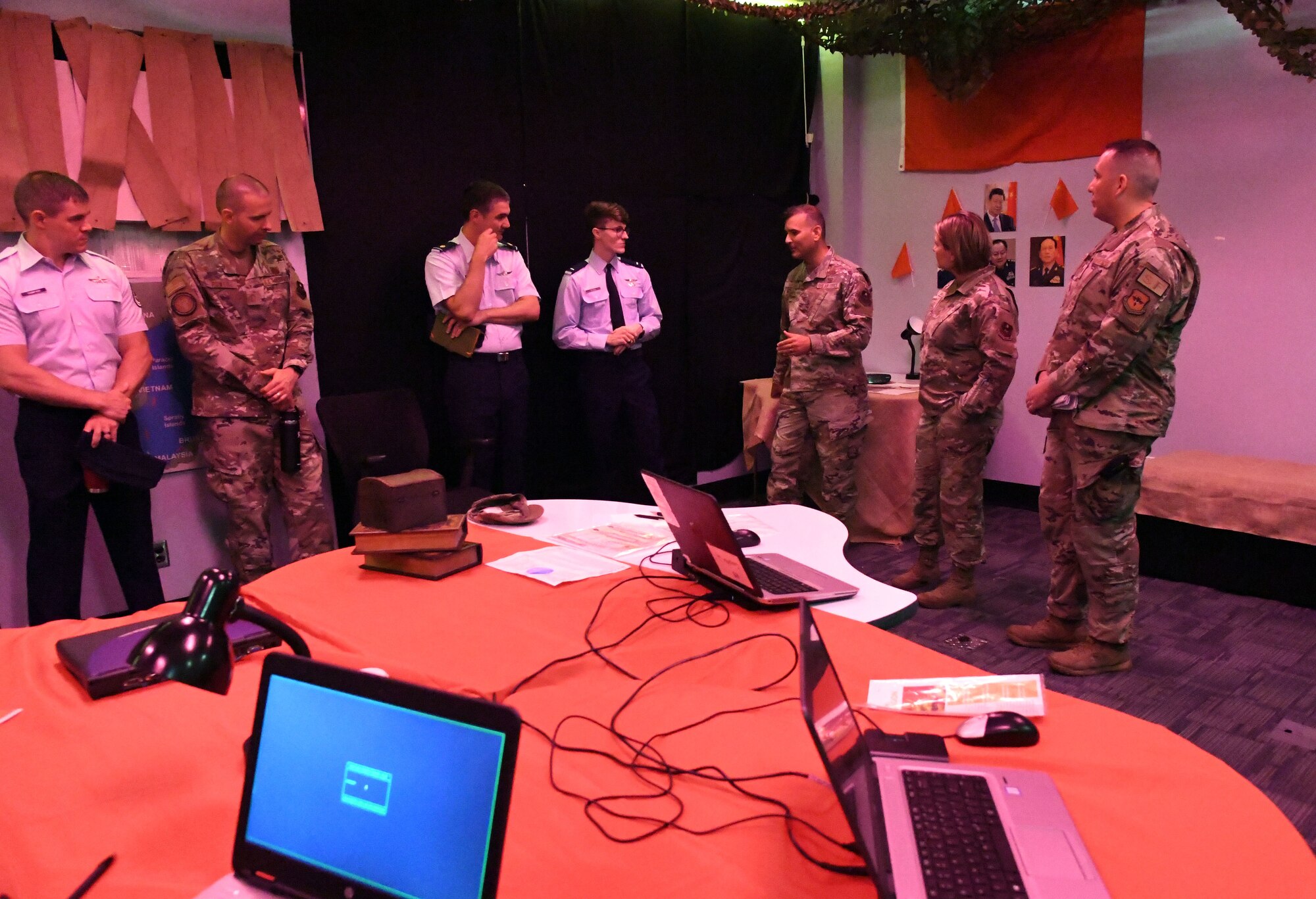 U.S. Air Force Col. Nicholas Dipoma, Second Air Force vice commander, and Chief Master Sgt. Kathleen McCool, Second Air Force command chief, tour the 333rd Training Squadron escape room used for cyber training during an immersion tour of the 81st Training Group inside Stennis Hall at Keesler Air Force Base, Mississippi, July 29, 2022. The tour also included the Levitow Training Support Facility and the 81st Medical Group clinical research lab. (U.S. Air Force photo by Kemberly Groue)