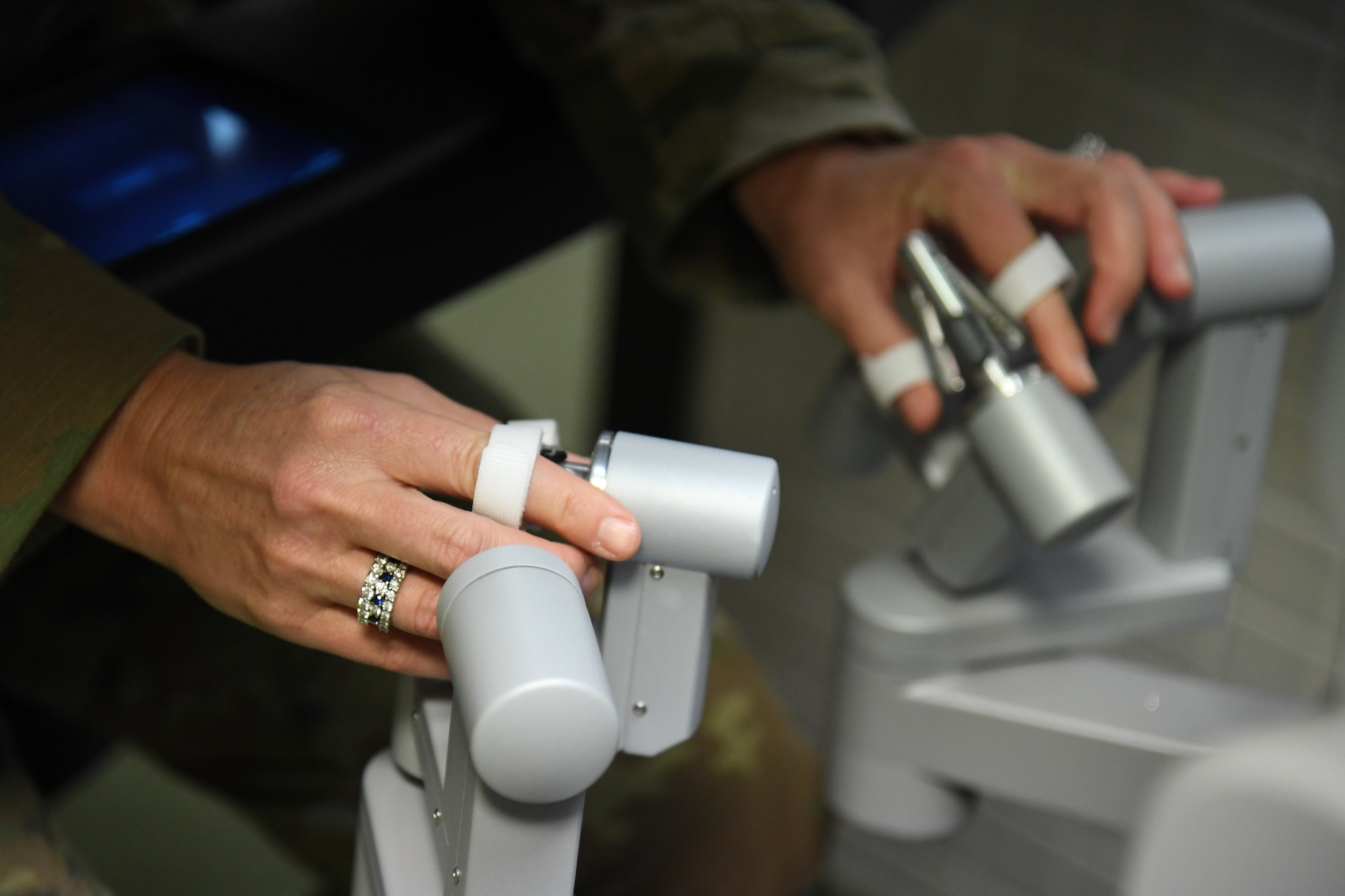 U.S. Air Force Chief Master Sgt. Kathleen McCool, Second Air Force command chief, operates a Da Vinci Robot trainer during an immersion tour inside the 81st Medical Group clinical research lab at Keesler Air Force Base, Mississippi, July 29, 2022. McCool and Col. Nicholas Dipoma, Second Air Force vice commander, participated in the tour, which also included the 334th Training Squadron air traffic control simulator and the Levitow Training Support Facility. (U.S. Air Force photo by Kemberly Groue)