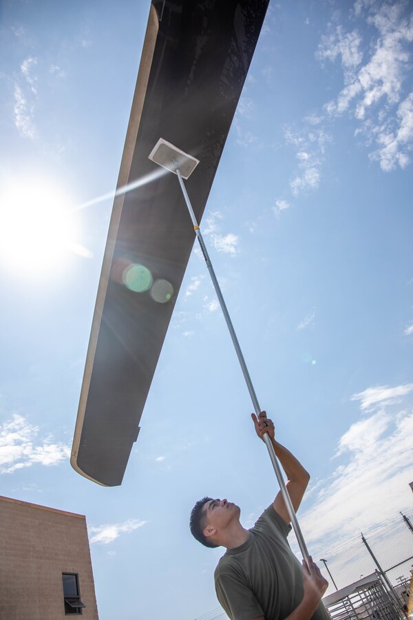 A U.S. Marine with Marine Light Helicopter Attack Squadron (HMLA) 775, Marine Aircraft Group 41, 4th Marine Aircraft Wing, Marine Forces Reserve, cleans the rotor blades of an AH-1Z Viper during Integrated Training Exercise (ITX) 4-22 at Marine Corps Air Station Camp Pendleton, Calif., July 28, 2022. Marines and Sailors with MAGTF-23 maintain various civilian careers while continuing to answer the irrational call to service in the Marine Corps Reserve. (U.S. Marine Corps photo by Lance Cpl. David Intriago)