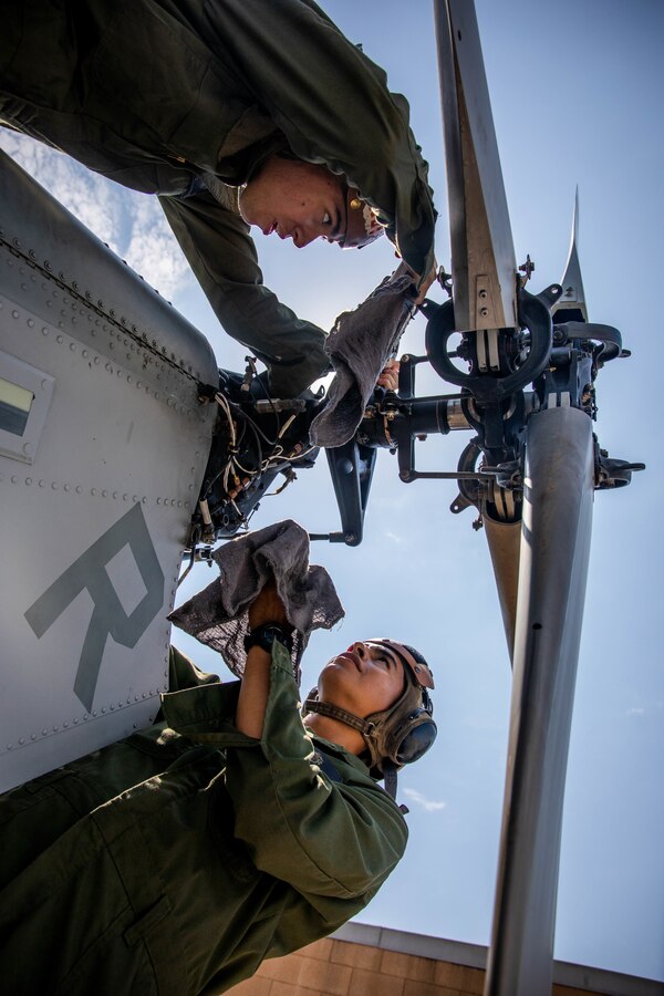 U.S. Marines with Marine Light Helicopter Attack Squadron (HMLA) 775, Marine Aircraft Group 41, 4th Marine Aircraft Wing, Marine Forces Reserve, conduct pre-flight maintenance on a AH-1Z Viper during Integrated Training Exercise (ITX) 4-22 at Marine Corps Air Station Camp Pendleton, Calif., July 28, 2022. Routine aircraft maintenance is required to ensure aircraft are operating within optimal flight conditions. ITX enables the Reserve Component to simulate a mobilization and deploy its forces in preparation for potential future deployments in the event of a contingency or crisis. (U.S. Marine Corps photo by Lance Cpl. David Intriago)