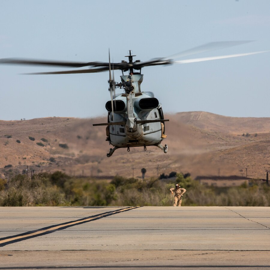 A U.S. Marine with Marine Light Helicopter Attack Squadron (HMLA) 775, Marine Aircraft Group 41, 4th Marine Aircraft Wing, Marine Forces Reserve, directs a UH-1Y Venom for take off during Integrated Training Exercise (ITX) 4-22 at Marine Corps Air Station Camp Pendleton, Calif., July 29, 2022. 4th Marine Aircraft Wing squadrons, including HMLA-775, Marine Medium Tiltrotor Squadron 764, Marine Fighter Attack Squadron 112, Marine Aerial Refueler Transport Squadron 234, and Marine Wing Support Squadron 473, worked side-by-side to execute an Expeditionary Advanced Base Operations scenario during ITX 4-22. MAG-41 tripled the combat radius of the AH-1Z Viper and UH-1Y Venom via multiple refueling methods, including the first use of the Tactical Aviation Ground Refueling System during an exercise by the Reserve Component. This vastly reduced the refueling time required and prevented MAG-41 personnel and aircraft from being targeted by the enemy. This scenario was carried out entirely by MAG-41 assets and demonstrated the Reserve Component's capability to execute missions described in Force Design 2030. (U.S. Marine Corps photo by Lance Cpl. David Intriago)