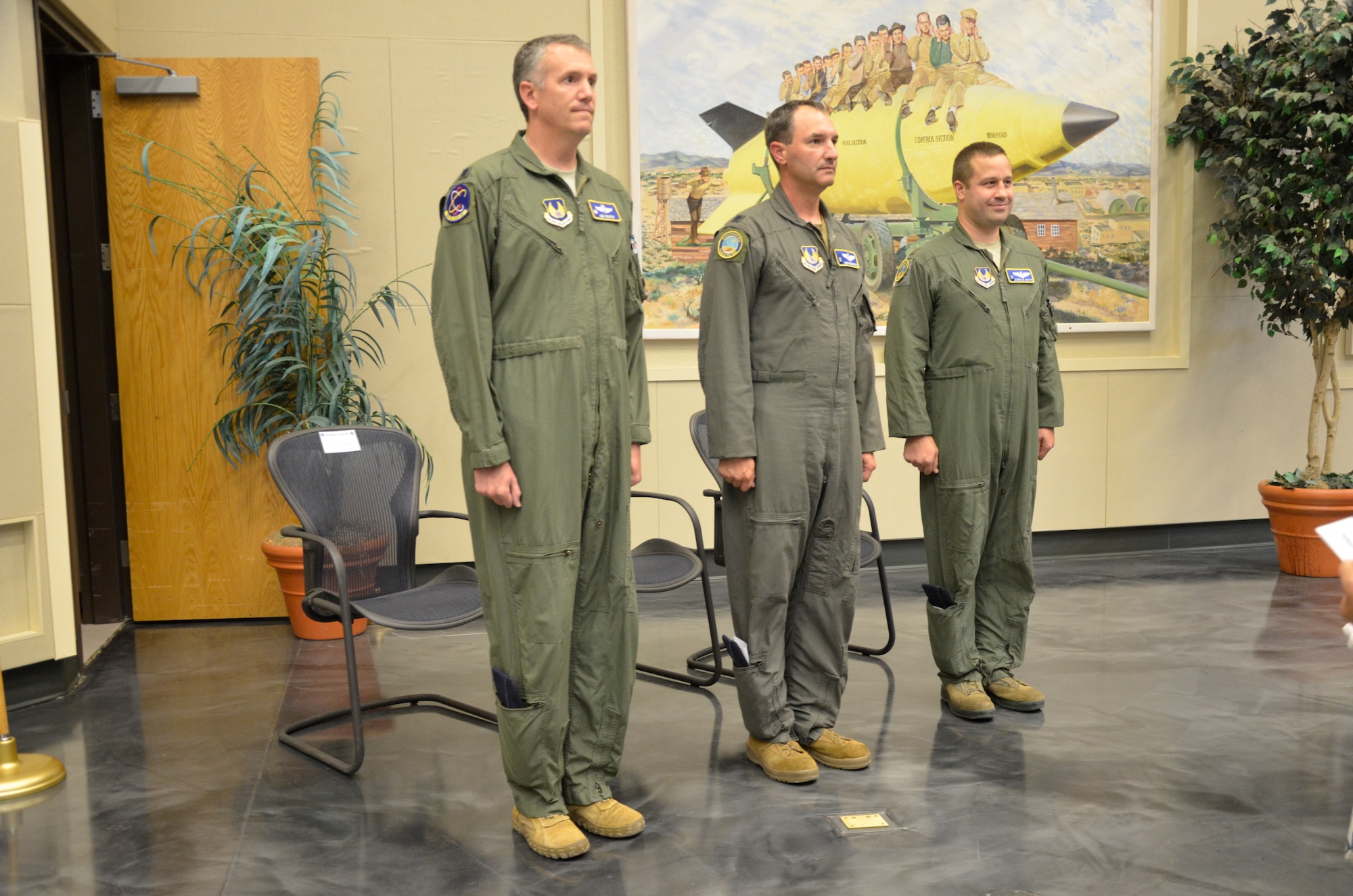 Maj. Joshua Smith, right, prepares to assume command of the 586th Flight Test Squadron, Detachment 1, during a July 13, 2022, change of command ceremony at White Sands Missile Range, New Mexico. Also pictured are Lt. Col. Roman Underwood, center, who relinquished command of the detachment to Smith during the ceremony, and Lt. Col. Alex Wolfard, then-commander of the 586th Flight Test Squadron at Holloman Air Force Base, New Mexico. (U.S. Army photo by Anne Marie Chadima)