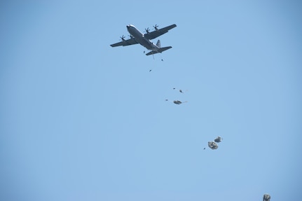 Staff Sgt. Rob Stokley, an airborne Soldier with Company C, 2nd Battalion, 134th Infantry Regiment, 45th Infantry Brigade Combat Team, Nebraska Army National Guard aligns his parachute to pack up after a high-performance jump from a C-130 “Hercules” on Rattlesnake Drop Zone at Fort Chaffee, Arkansas, July 23, 2022.  The 2nd Battalion is the newest unit to join the 45th IBCT, bringing with them airborne capabilities that the 45th has not had in more than 50 years.  (Oklahoma National Guard photo by Staff Sgt. John Stoner)