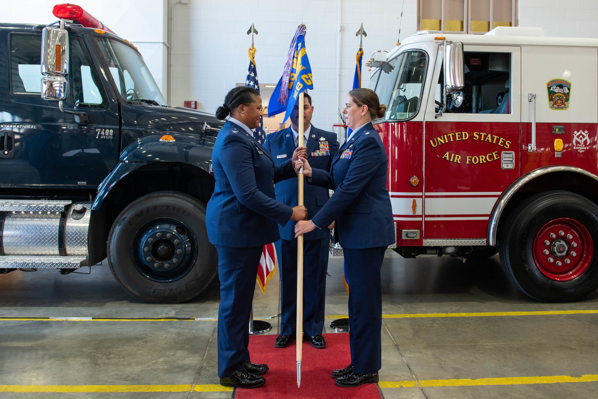 U.S. Air Force Lt. Col. Melissa D. Jumper, the incoming 28th Civil Engineer Squadron commander, receives the 28th Civil Engineer Squadron’s guidon from U.S. Air Force Col. Patrice O. Holmes, 28th Mission Support Group commander during an assumption of command at Ellsworth Air Force Base, S.D., July 29, 2022.
