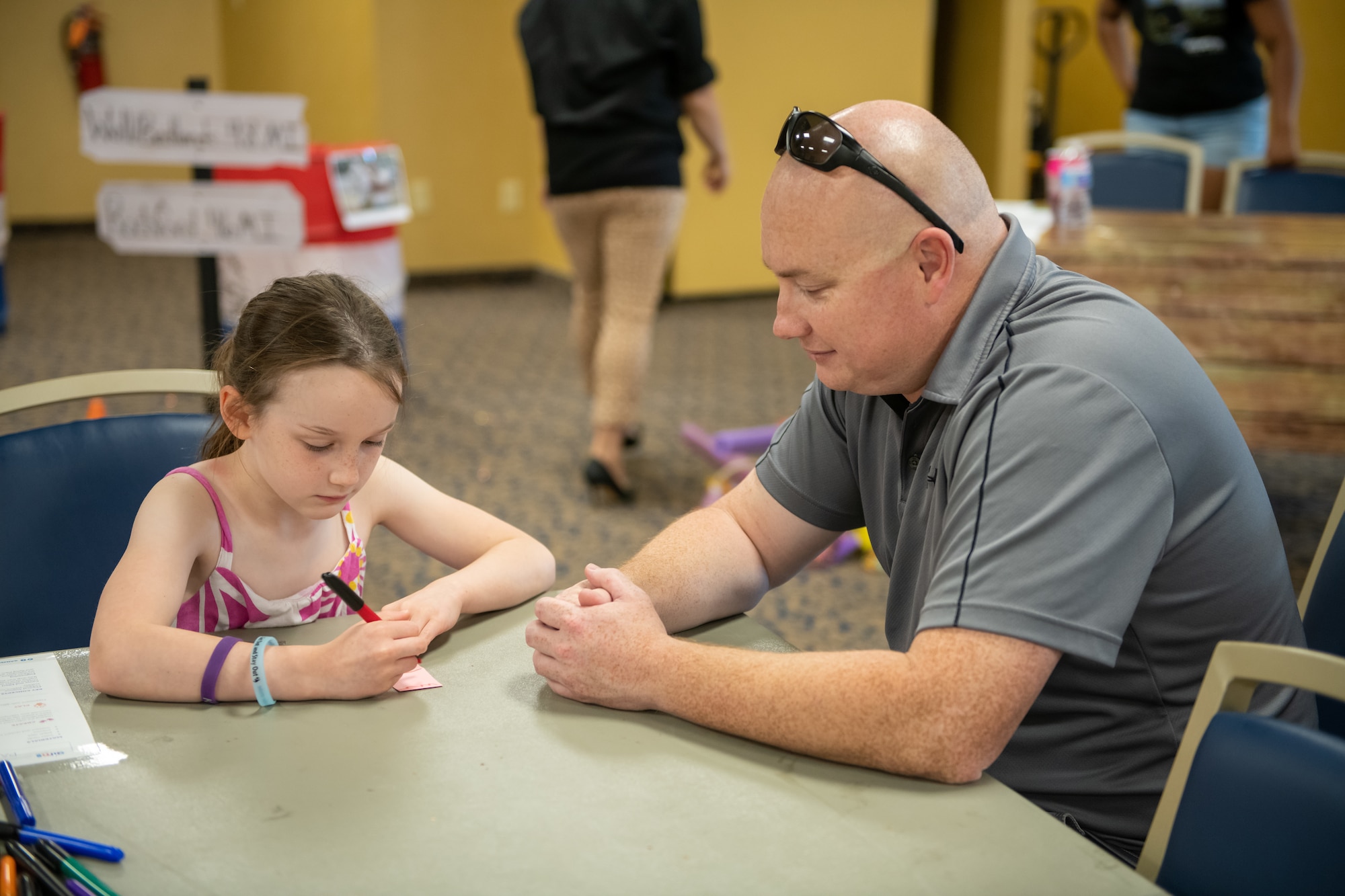 A girl and her father spend time together at the “Back 2 School Roundup” held at Ellsworth Air
Force Base, S.D., July 30, 2022.
