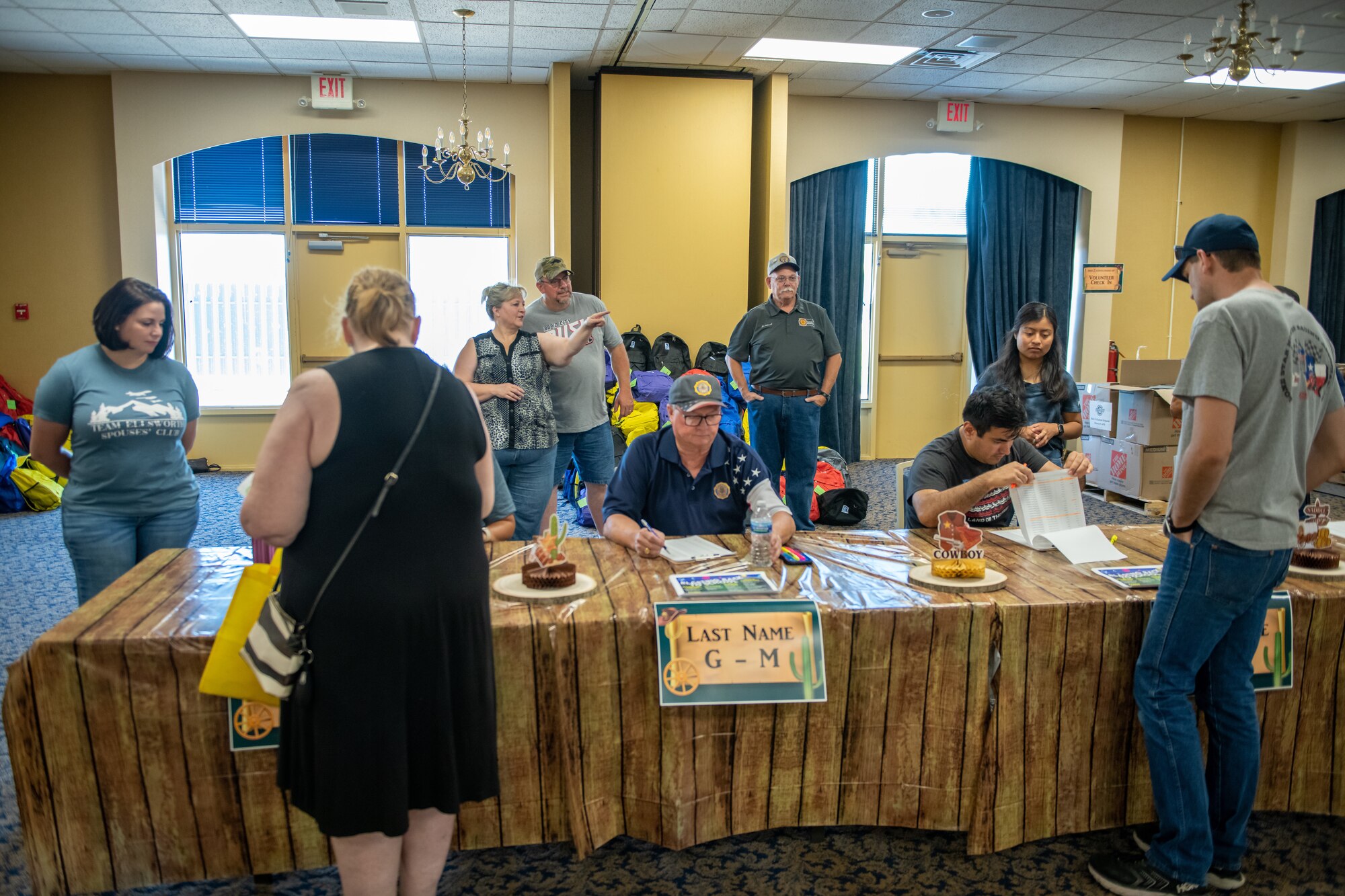 Volunteers hand out schoolbags filled with school supplies to local families at Ellsworth Air
Force Base, S.D., July 30, 2022.