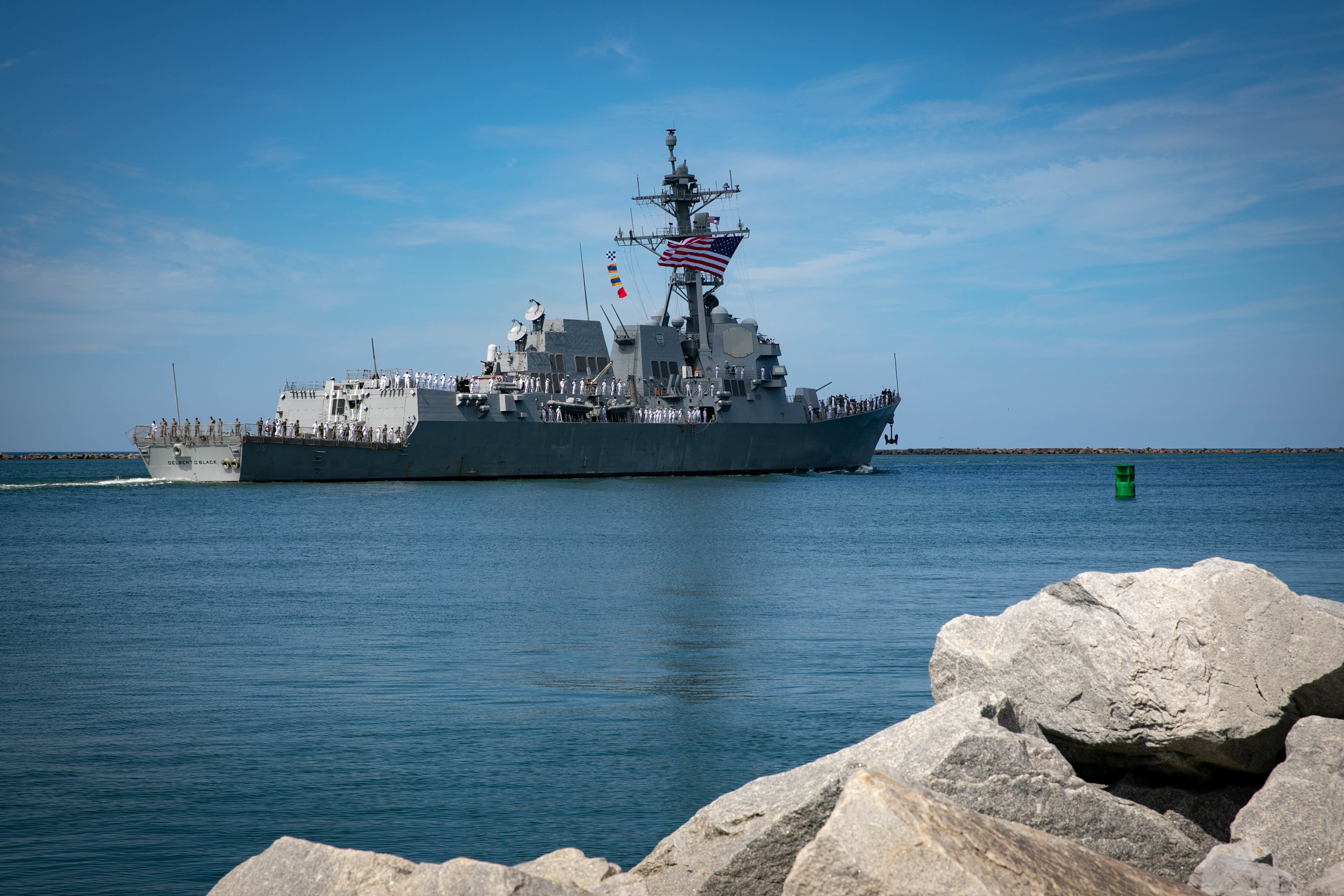 The Arleigh Burke-class guided missile destroyer USS Delbert D. Black (DDG 119) departs Naval Station Mayport for deployment, Aug 2, 2022.