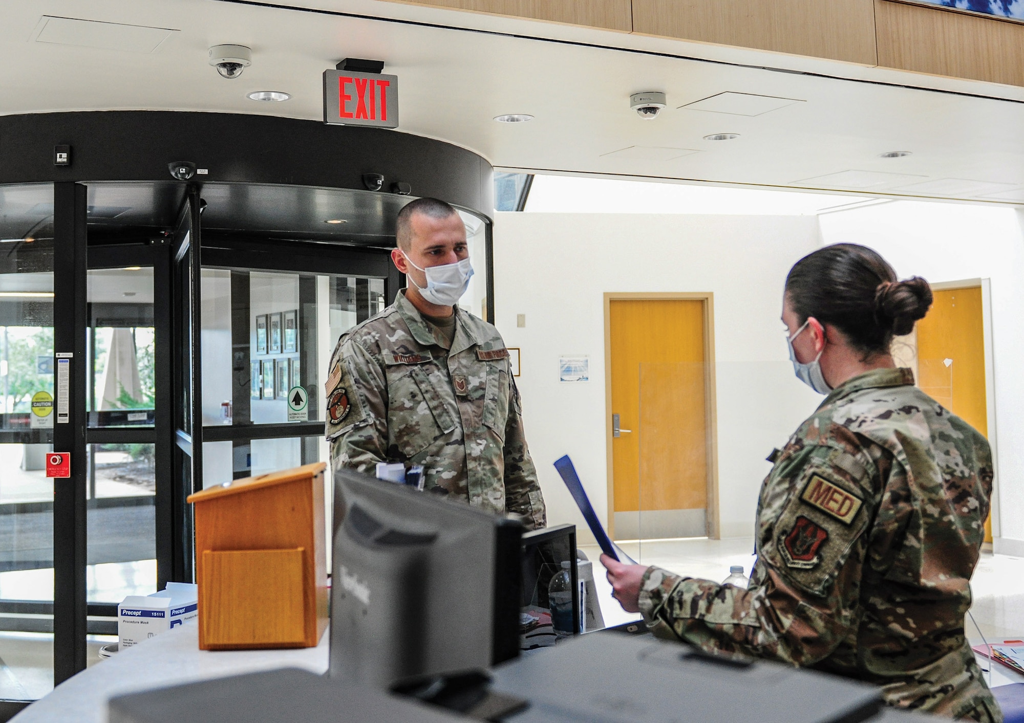 Master Sgt. Aubrey Booher (right), 445th Aerospace Medicine Squadron, checks in Tech. Sgt. Tyler Williams (left), 445th Maintenance Squadron technician, at the Wright-Patterson Air Force Base Medical Center during the July 9, 2022 unit training assembly.