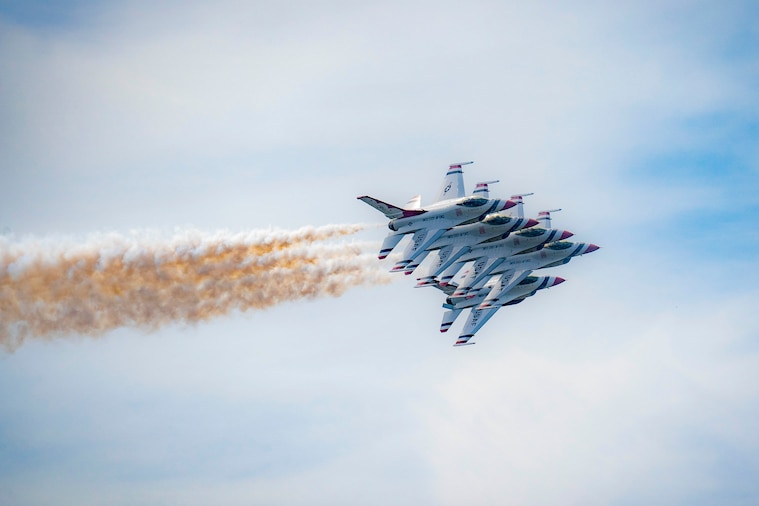 Five aircraft fly in formation.