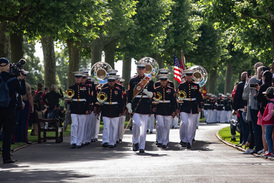 U.S. Marines with the 2d Marine Division Band march in formation during a ceremony at Aisne-Marne American Cemetery, Belleau, France, May 29, 2022. This Memorial Day ceremony was held to commemorate the 104th anniversary of the Battle of Belleau Wood. The visit is to honor those who made the ultimate sacrifice for their respective countries during World War I.