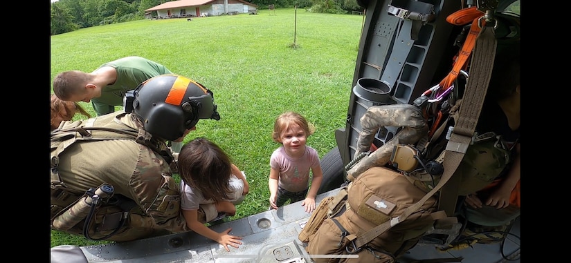 Kentucky Army National Guard's Detachment 1, Charlie Company 2/238th Aviation Regiment, MEDEVAC, conduct hoist and land rescue mission for victims of flooding in eastern Kentucky on July 28, 2022. Pilots and crew with the MEDEVAC have been working constantly for days to rescue victims trapped on house roofs, trees, and other high points to avoid floodwaters. (Courtesy photos by Detachment 1, Charlie Company 2/238th Aviation Regiment, MEDEVAC)