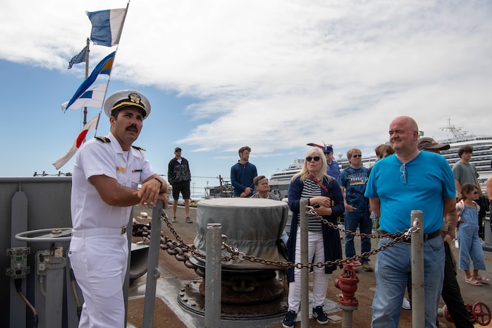 Lt. j.g. Andrew Middlebrooks, a communications officer assigned to the Arleigh Burke-class guided missile destroyer USS John Paul Jones (DDG 53), explains what the foc’s’le is to a tour group during Fleet Week, Aug. 2, 2022. Fleet Week Seattle is a time-honored celebration of the sea services and provides an opportunity for the citizens of Washington to meet Sailors, Marines and Coast Guardsmen, as well as witness firsthand the latest capabilities of today's maritime services. (U.S. Navy photo by Mass Communication Specialist 2nd Class Victoria Galbraith)