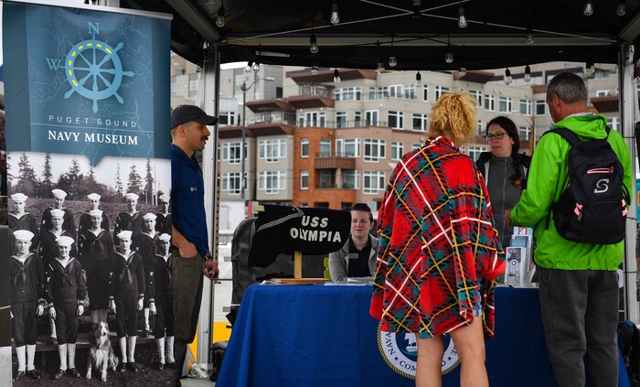 Puget Sound Navy Museum volunteers at pier 62 speak with the public about naval heritage August 2 in support of Fleet Week Seattle 2022. Fleet Week Seattle is a time-honored celebration of the sea services that provides an opportunity for the citizens of Washington to meet Sailors, Marines and Coast Guardsmen, and witness the latest capabilities of today’s maritime services. (U.S. Navy photo by Mass Communication Specialist 2nd Class Aranza Valdez)