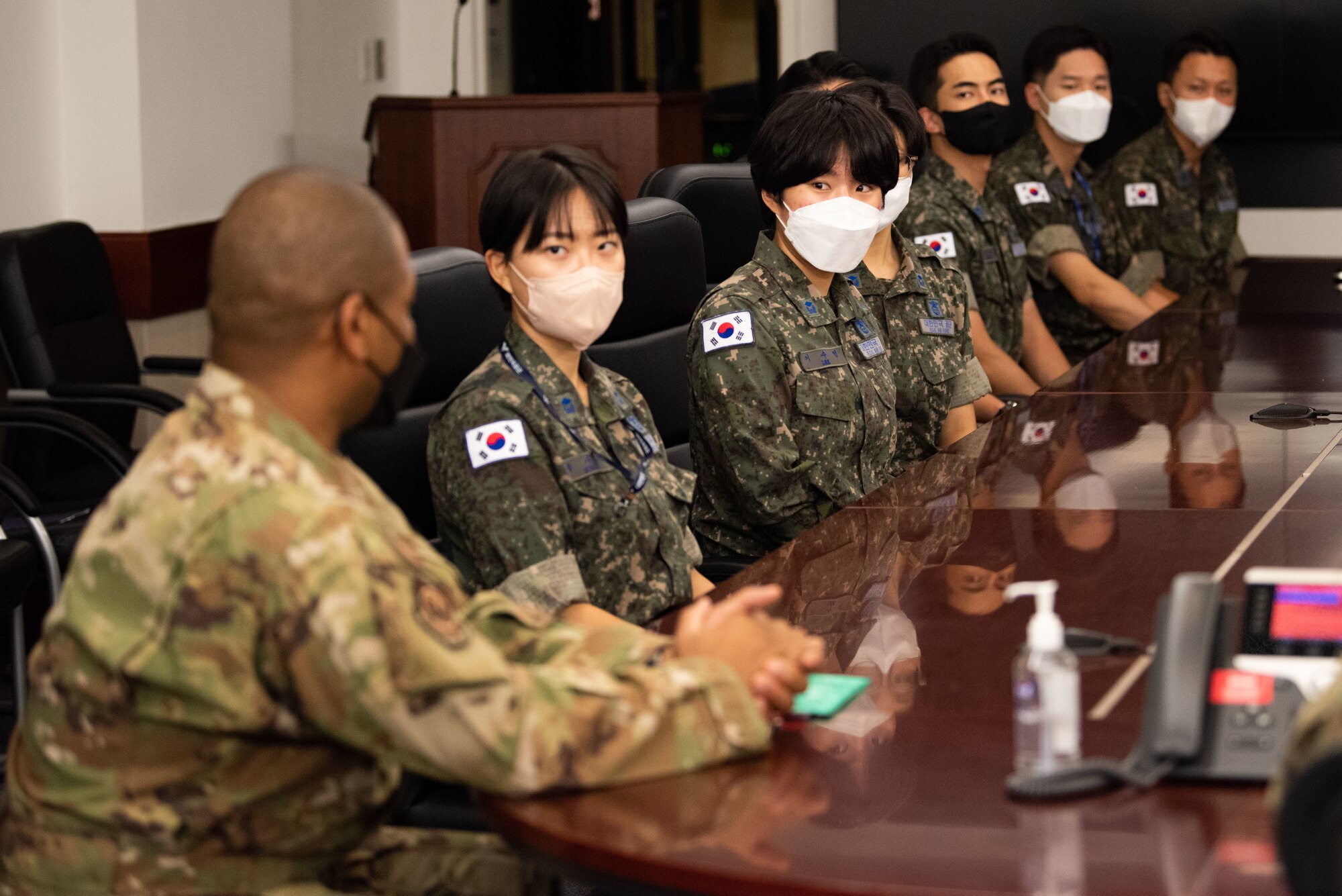 U.S. Air Force Lt. Col. Romaine Russell, 7th Air Force joint plans director, meets with Republic of Korea Air Force translator officers before an immersion tour at Osan Air Base, Republic of Korea, Aug. 2, 2022.