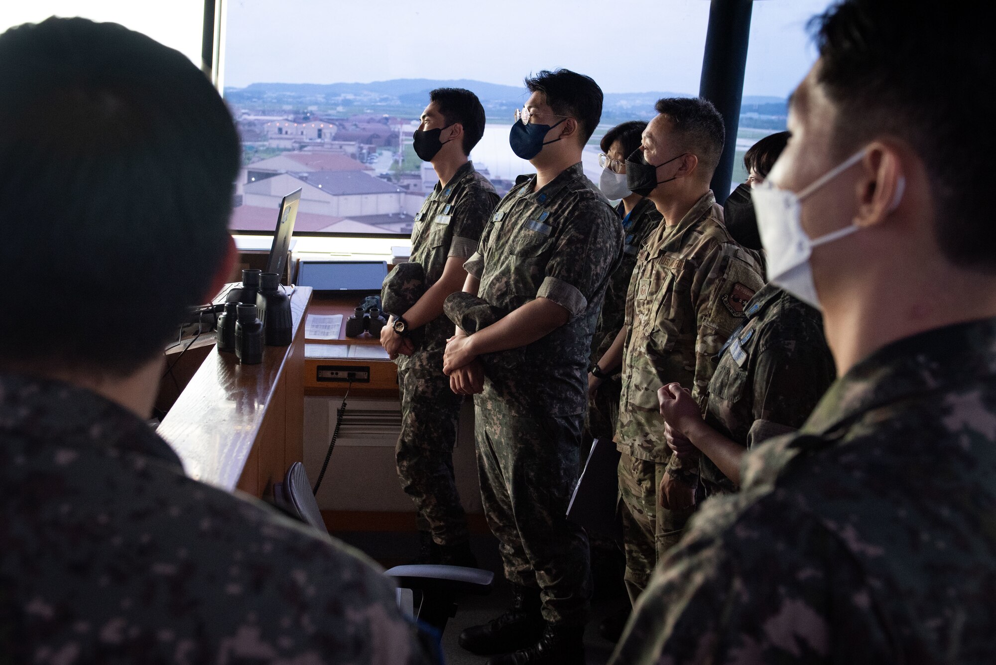 Republic of Korea Air Force translator officers observe air traffic controllers performing their duties during an immersion tour at Osan Air Base, Republic of Korea, Aug. 2, 2022.