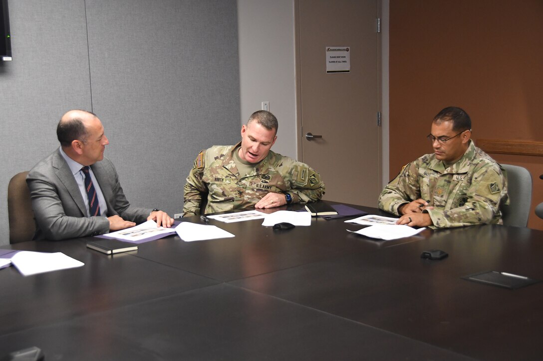 U.S. Army Corps of Engineers (USACE) Jacksonville District Commander, Col. James L. Booth, (right) provides the Under Secretary of The Army, Hon. Gabe Camarillo an overview and brief of USACE projects in the Jacksonville District Area of Responsibility at the facilities of the Puerto Rico National Guard in Fort Buchanan, Guaynabo, July 27, 2022. (USACE photos by Mark Rankin)