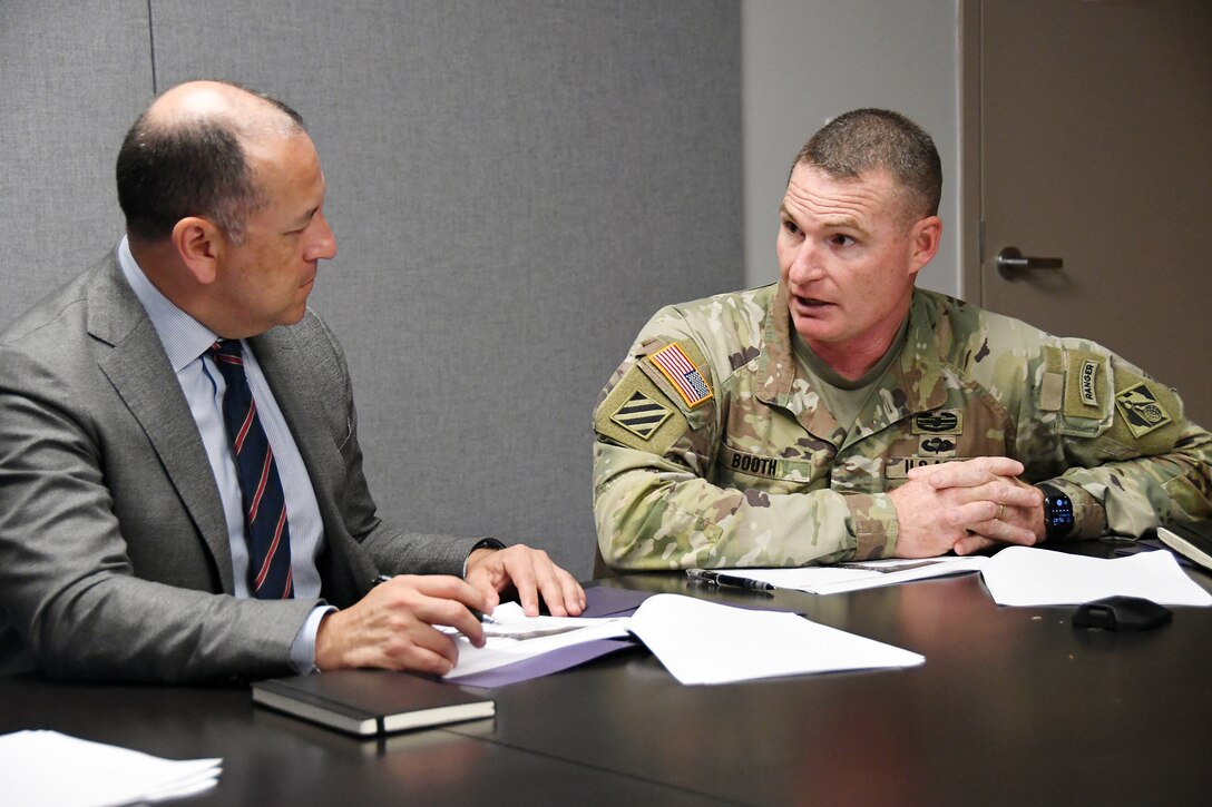 U.S. Army Corps of Engineers (USACE) Jacksonville District Commander, Col. James L. Booth, (right) provides the Under Secretary of The Army, Hon. Gabe Camarillo an overview and brief of USACE projects in the Jacksonville District Area of Responsibility at the facilities of the Puerto Rico National Guard in Fort Buchanan, Guaynabo, July 27, 2022. (USACE photos by Mark Rankin)