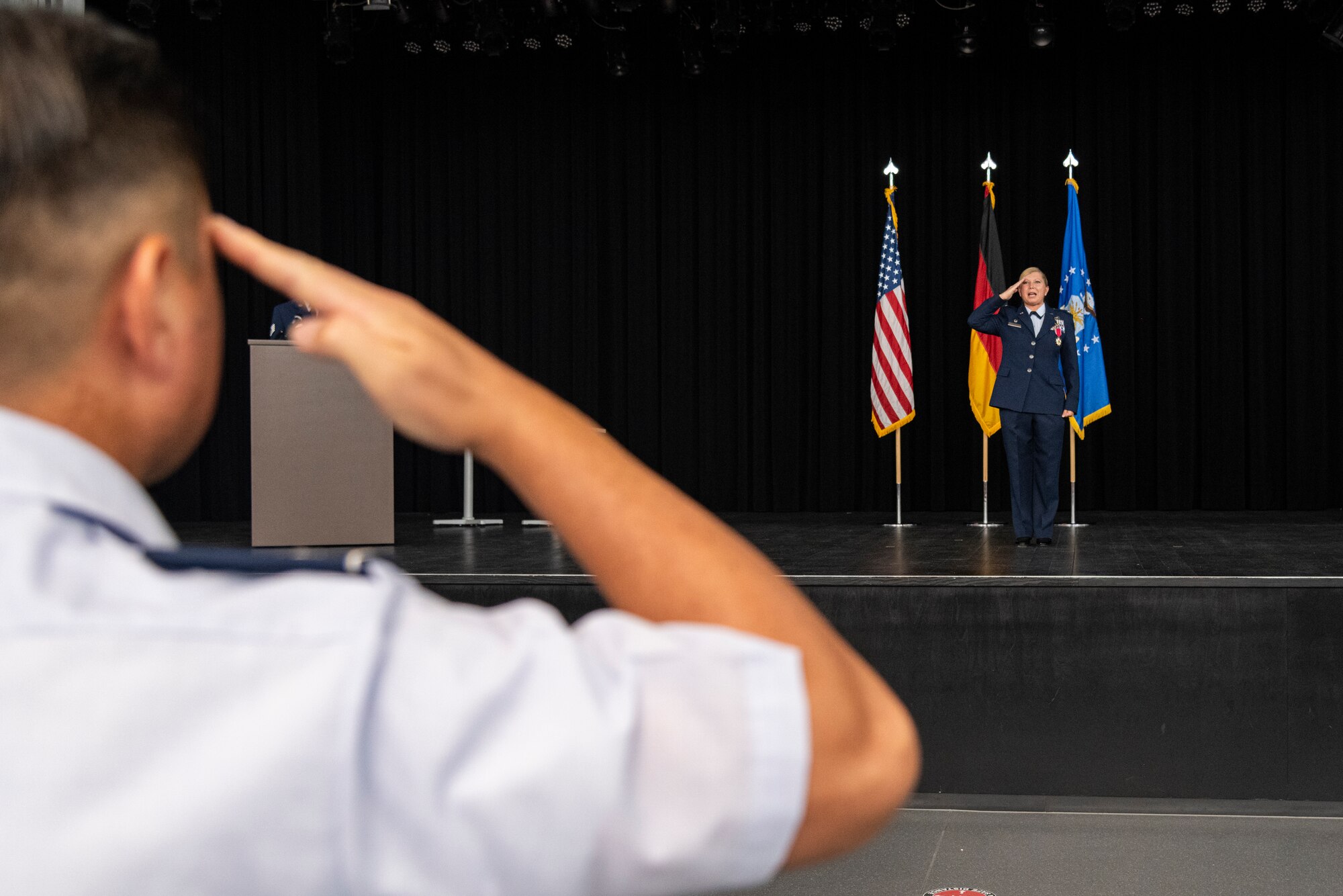 A military member salutes another military member