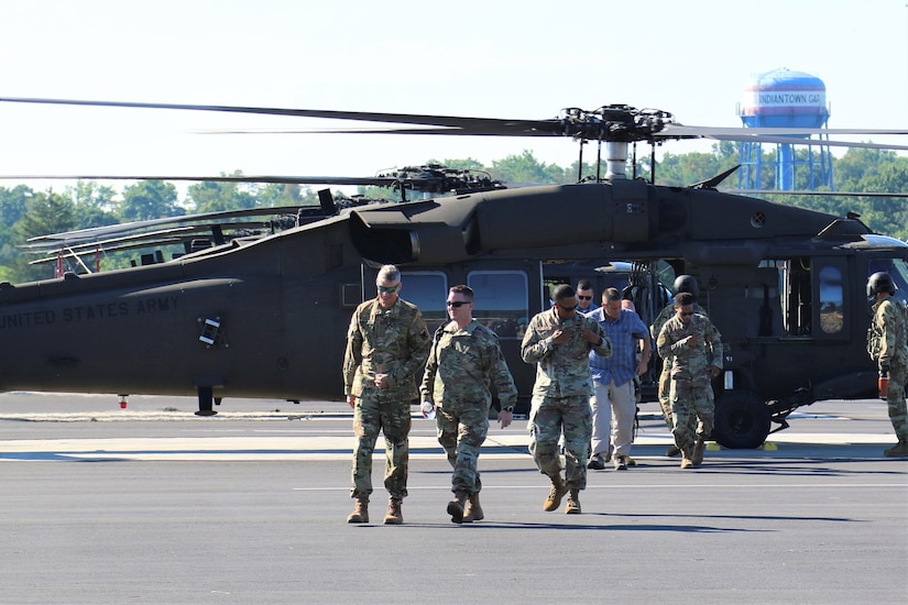 U.S. Army Gen. Daniel R. Hokanson, Chief of the National Guard Bureau, visits the Eastern Army National Guard Aviation Training Site to receive an orientation on the new UH-60V Black Hawk helicopters and take one for a quick flight.