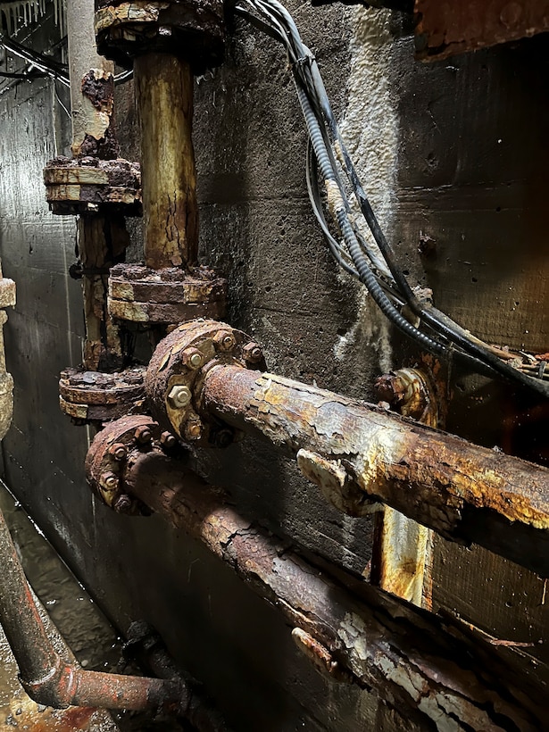 Mechanics replace old, rusted pipes for hydraulics system