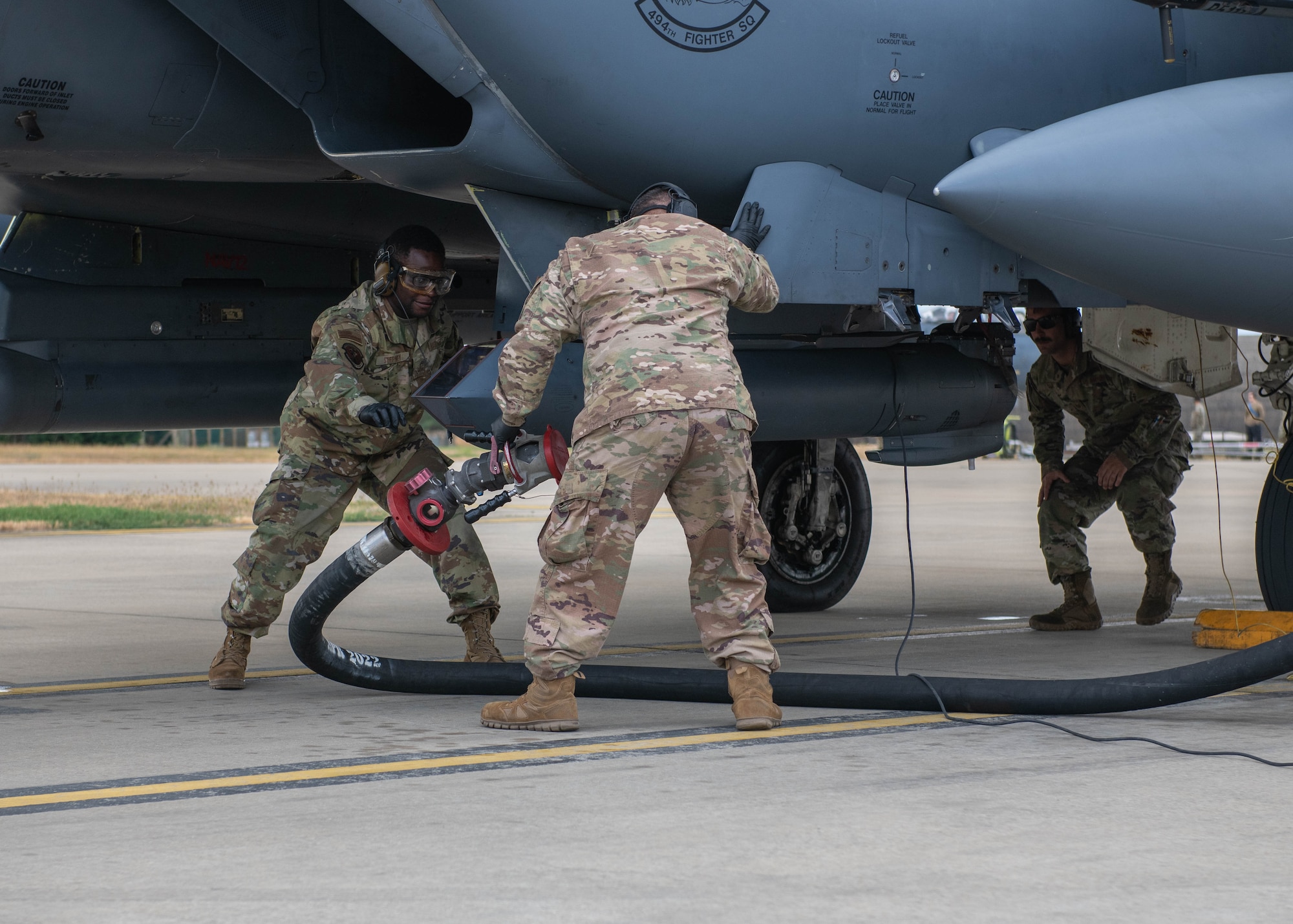U.S. Air Force Airmen assigned to the 435th Contingency Response Squadron out of Ramstein Air Base, Germany, conduct hot-pit refueling training with the 48th Maintenance Squadron at Royal Air Force Lakenheath, England, July 27, 2022. The training aids in expanding the squadron’s Agile Combat Employment capabilities. (U.S. Air Force photo by Airman 1st Class Olivia Gibson)