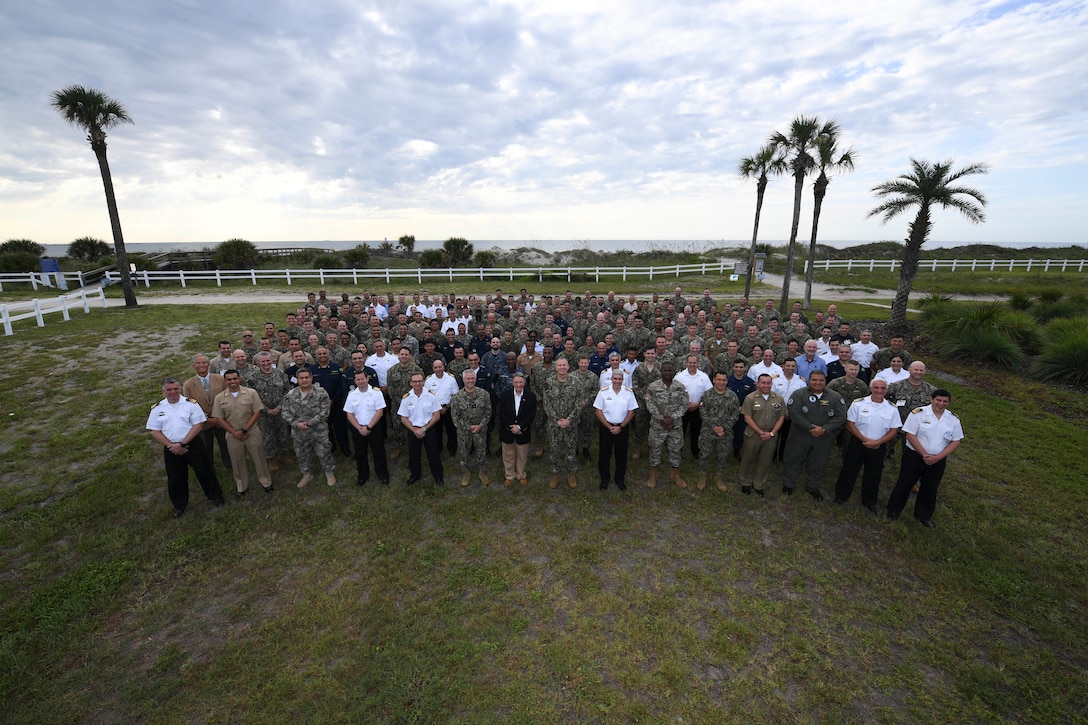 U.S. and partner nation participants from the Combined Force Maritime Component Command pose for a group photo at the start of PANAMAX 2022, at Naval Station Mayport, Fla., Aug. 2, 2022. Exercise PANAMAX 2022 is a U.S. Southern Command-sponsored exercise that provides important training opportunities for nations to work together and build upon the capability to plan and conduct complex multinational operations. The exercise scenario involves security and stability operations to ensure free flow of commerce through the Panama Canal.