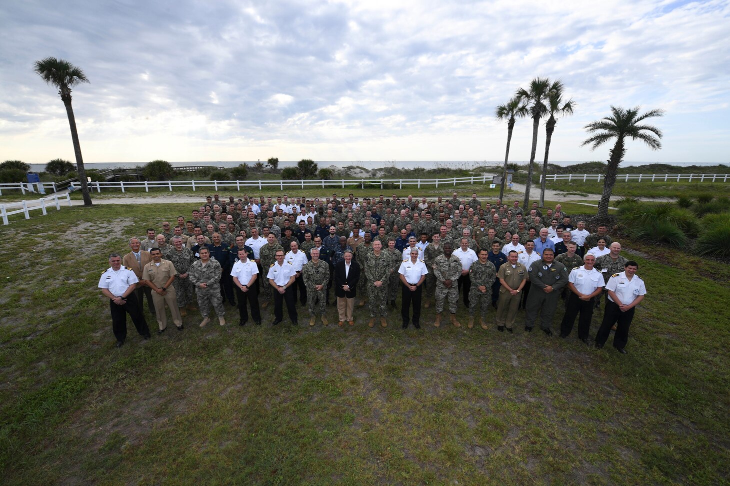 U.S. and partner nation participants from the Combined Force Maritime Component Command pose for a group photo at the start of PANAMAX 2022, at Naval Station Mayport, Fla., Aug. 2, 2022. Exercise PANAMAX 2022 is a U.S. Southern Command-sponsored exercise that provides important training opportunities for nations to work together and build upon the capability to plan and conduct complex multinational operations. The exercise scenario involves security and stability operations to ensure free flow of commerce through the Panama Canal.