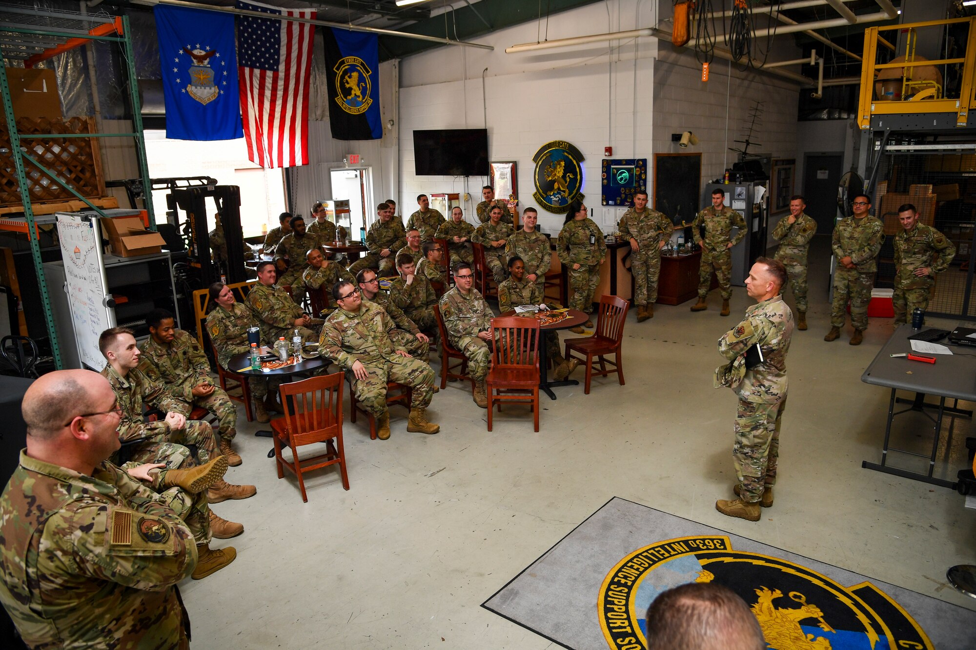 A Command Chief talks to a room full of Airmen.