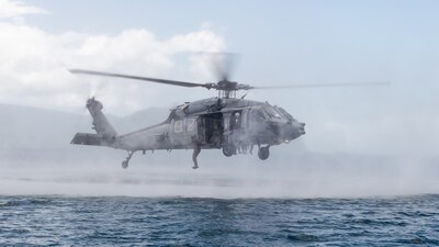 Australian Army soldiers jump from a U.S. Navy MH-60S Sea Hawk helicopter during RIMPAC 2022.