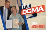 Gila Langford receives an award.