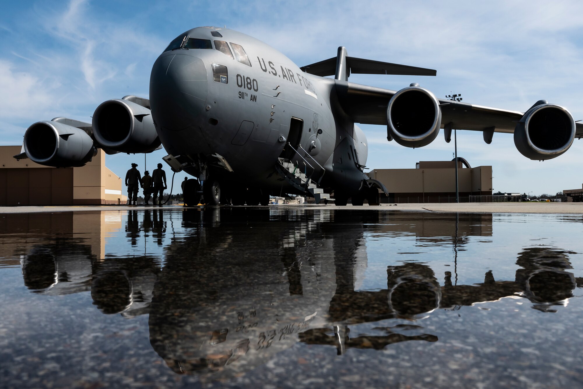 Airmen assigned to the 911th Aircraft Maintenance Squadron conduct a pre-flight inspection on a C-17 Globemaster III at the Pittsburgh International Airport Air Reserve Station, Pennsylvania, April 22, 2022.