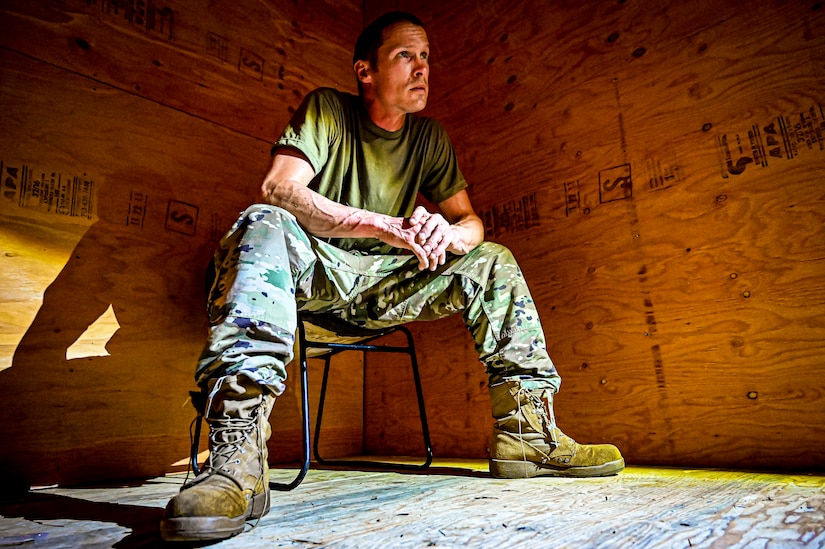 A U.S. Army National Guard Soldier assigned to the 340th Military Police company simulates the in-processing of a detainee as part of a simulated exercise on Joint Base McGuire-Dix Lakehurst, N.J., July 30, 2022. Soldiers from the 333rd MP Brigade, 340th MP Battalion gathered here for Gotham Justice, a four-week exercise that trained, challenged and improved Soldiers’ primary skill sets and core MP competencies required in detention operations and security and mobility support operations. (U.S. Air Force photo by Senior Airman Matt Porter)