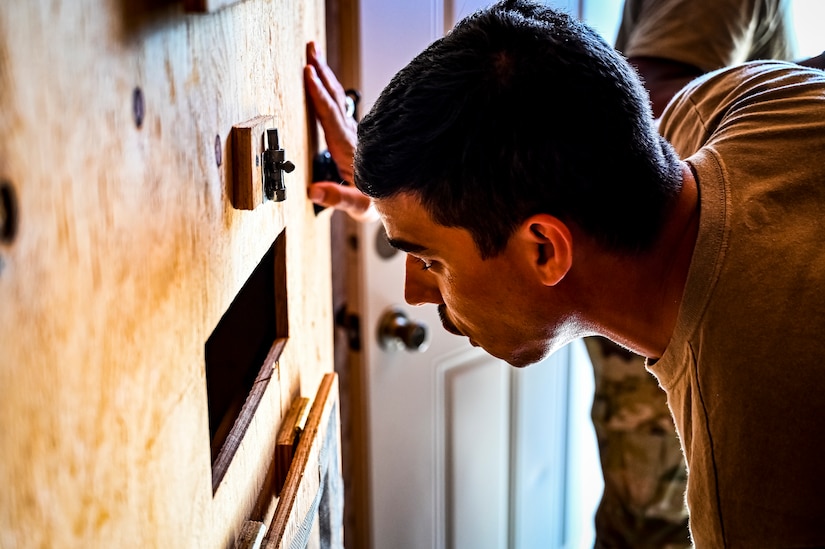 A U.S. Army National Guard Soldier assigned to the 340th Military Police company simulates the in-processing of a detainee as part of a simulated exercise on Joint Base McGuire-Dix Lakehurst, N.J., July 30, 2022. Soldiers from the 333rd MP Brigade, 340th MP Battalion gathered here for Gotham Justice, a four-week exercise that trained, challenged and improved Soldiers’ primary skill sets and core MP competencies required in detention operations and security and mobility support operations. (U.S. Air Force photo by Senior Airman Matt Porter)