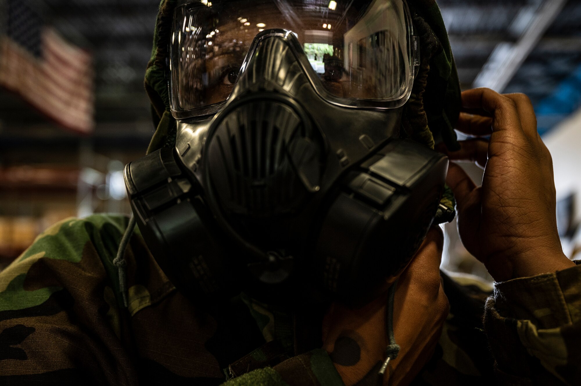 Senior Airman Jeremy Hawkins, 911th Logistics Readiness Squadron supply technician, dons mission-oriented protective posture gear at the Pittsburgh International Airport Air Reserve Station, Pennsylvania, May 7, 2022.