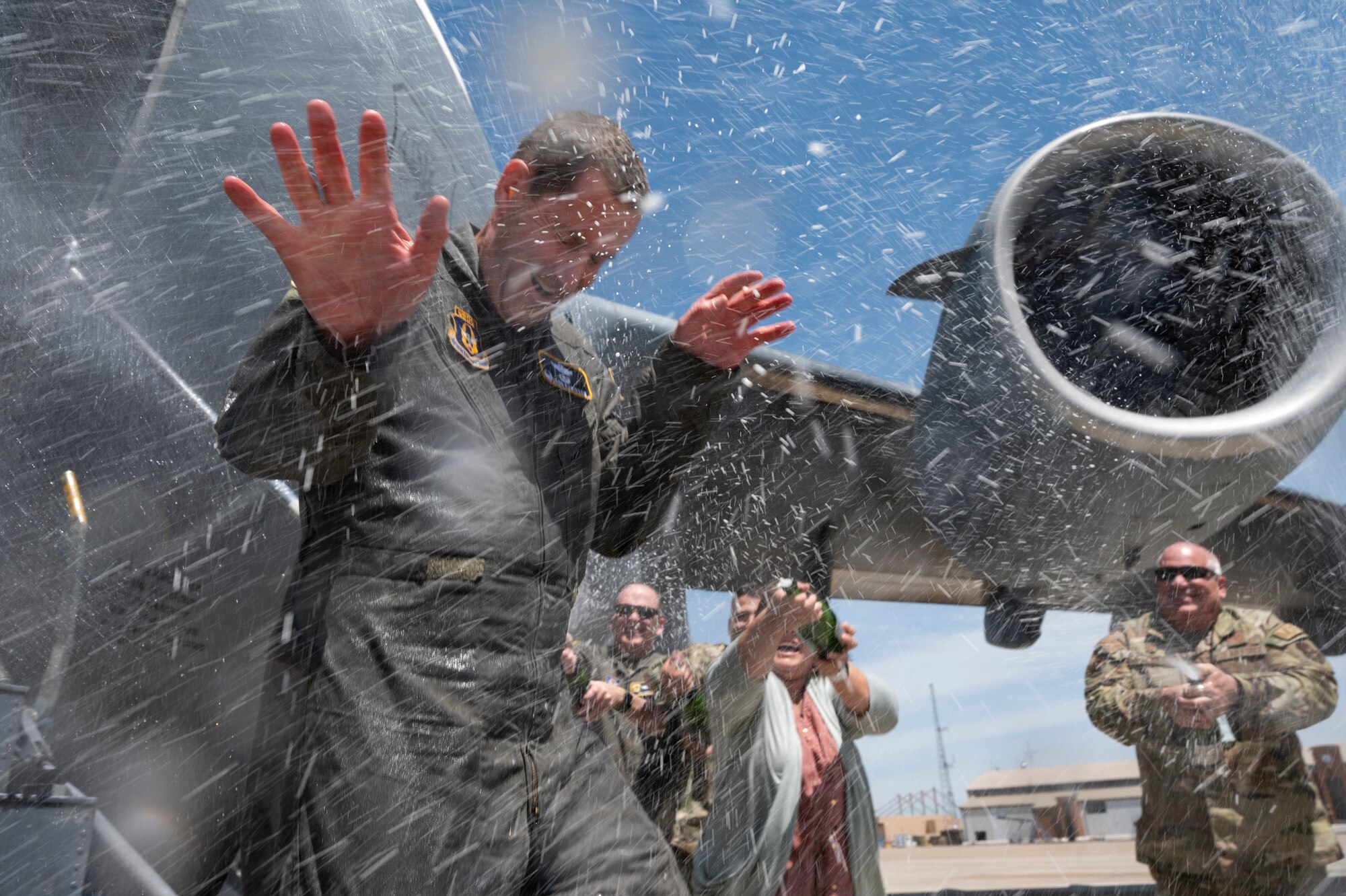 Col. John F. Robinson, 911th Airlift Wing commander, is sprayed with champagne after returning from a flight at the Pittsburgh International Airport Air Reserve Station, Pennsylvania, May 10, 2022.