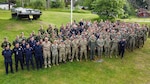 Personnel representing various global military units supporting Exercise Baltic Operations 2022 (BALTOPS 22) pause at the Ravlunda site during National Day of Sweden, June 6. The Naval Surface Warfare Center Panama City Division (NSWC PCD) Integrated Mine Countermeasures Tactics team provided the combined task group staff with support during the exercise and brought that experience back to the Navy lab. BALTOPS, which began in 1975, is the premier maritime-focused annual exercise that takes place in the Baltic Region and demonstrates partnership, security and preserving regional peace. (courtesy photo)