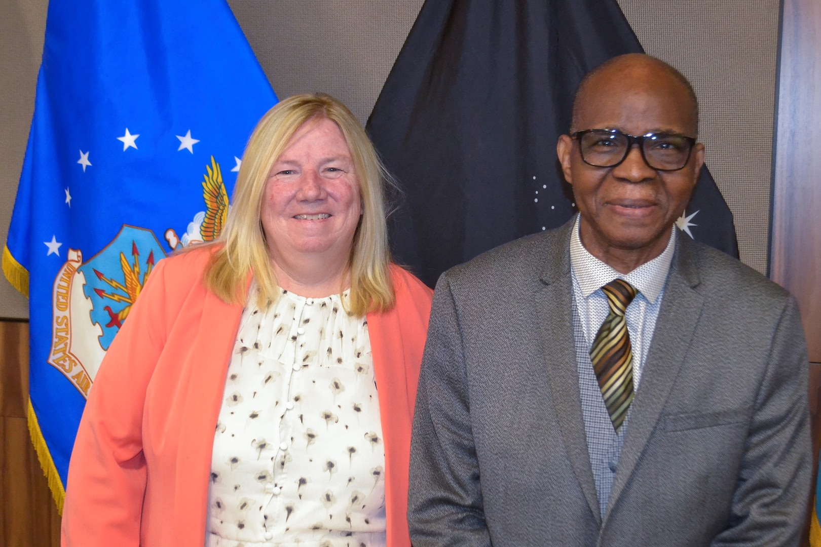 DLA Troop Support honored the careers of Colleen Hunt, left, a business process analyst in the Process Procurement division, who retired after 40 years of federal service and George Oseyemi, right, who retired after 21 years of federal service as a business systems analyst in the Medical supply chain, during a retirement ceremony July 28, 2022 in Philadelphia.