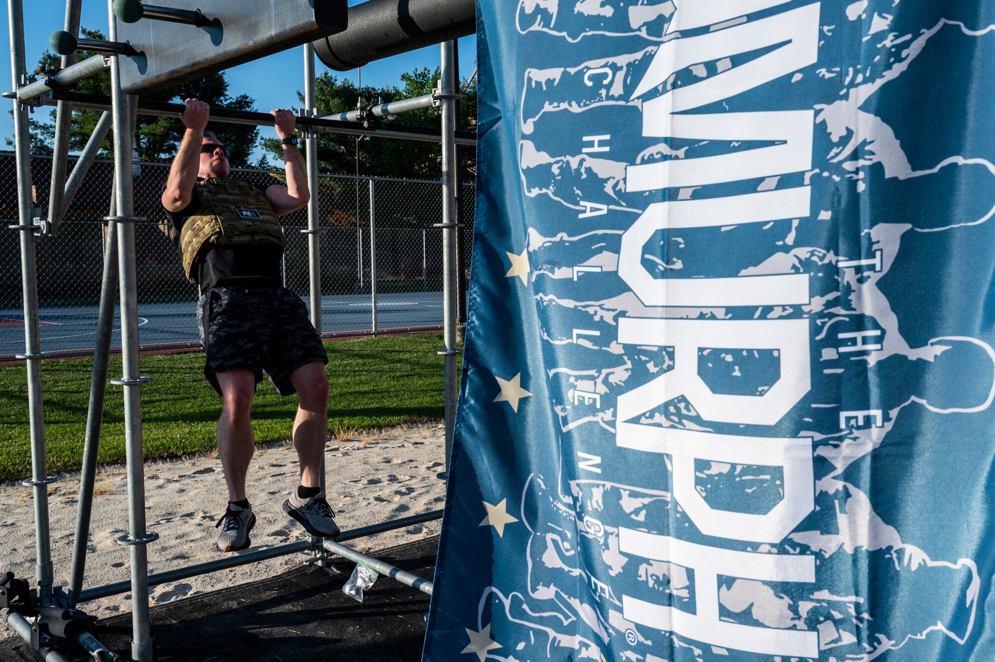 Tech. Sgt. Joseph Anthony, 911th Aeromedical Staging Squadron aeromedical technician, performs a pull-up as part of the Murph Challenge at the Pittsburgh International Airport Air Reserve Station, Pennsylvania, May 18, 2022.