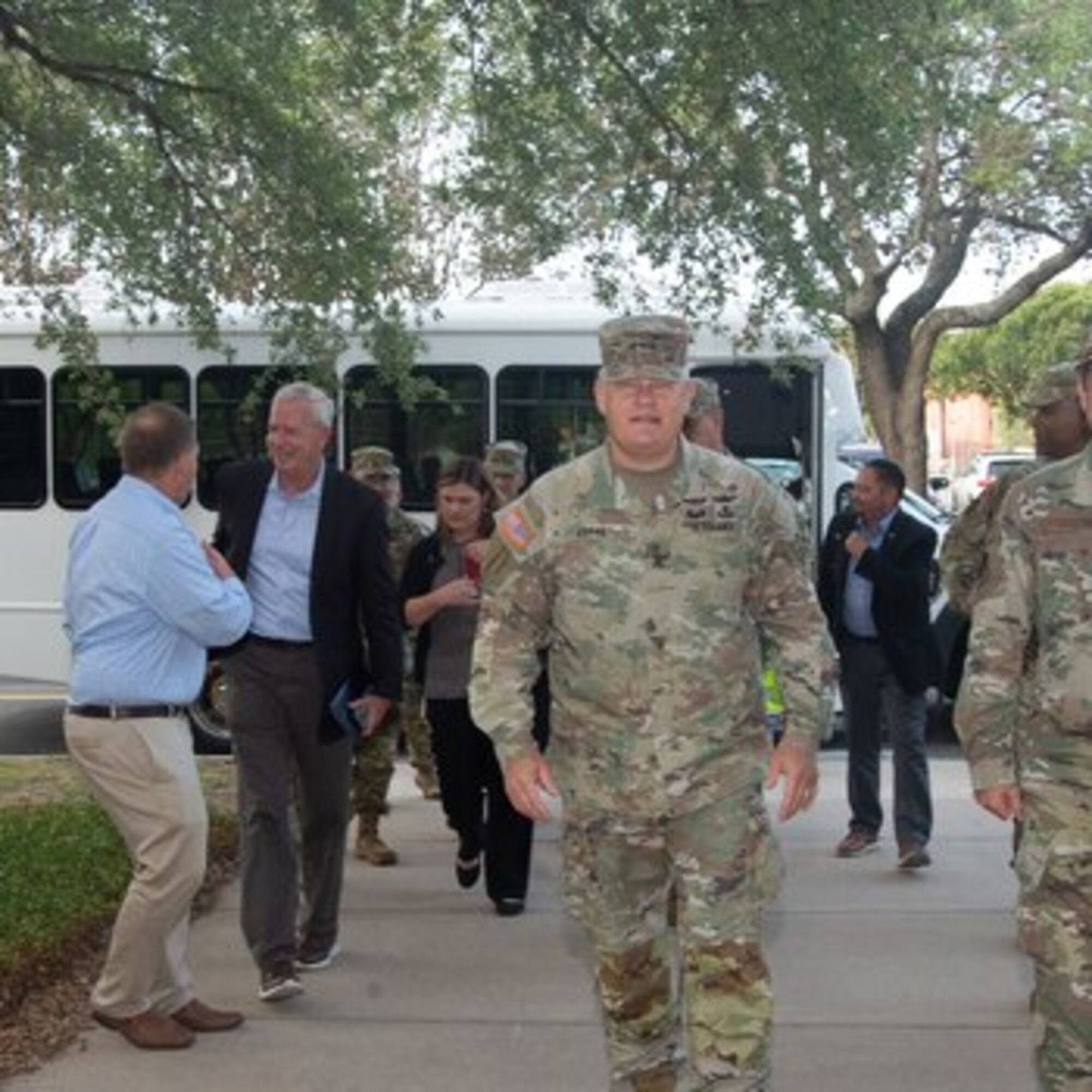 Two military leaders walk into a building.