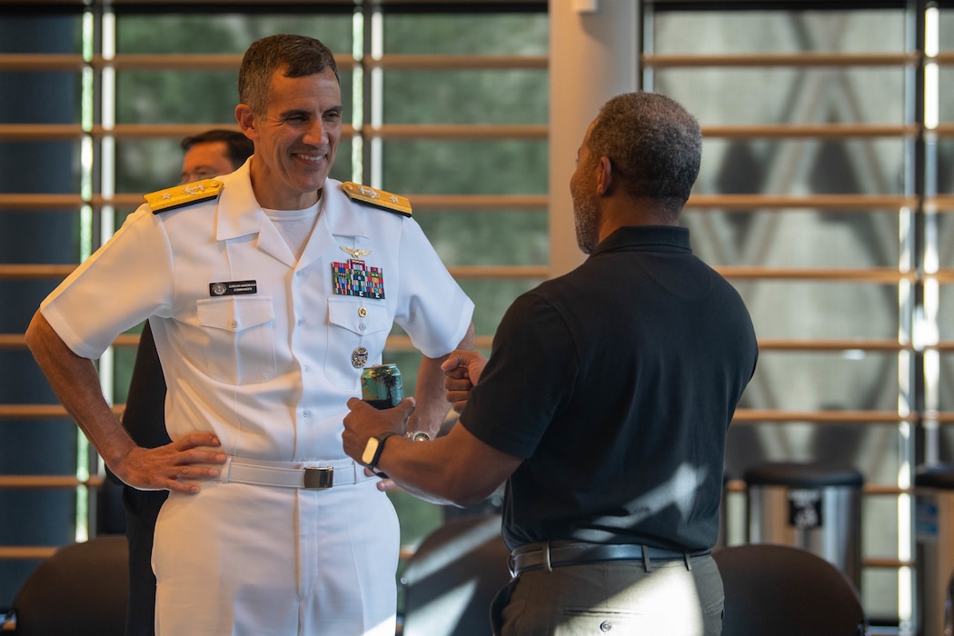 Rear Adm. Carlos Sardiello, commander, Carrier Strike Group 1, mingles with other attendees during a reception at City Hall during Fleet Week, Aug. 3, 2022. Fleet Week Seattle is a time-honored celebration of the sea services and provides an opportunity for the citizens of Washington to meet Sailors, Marines and Coast Guardsmen, as well as witness firsthand the latest capabilities of today's maritime services. (U.S. Navy photo by Mass Communication Specialist 2nd Class Victoria Galbraith)